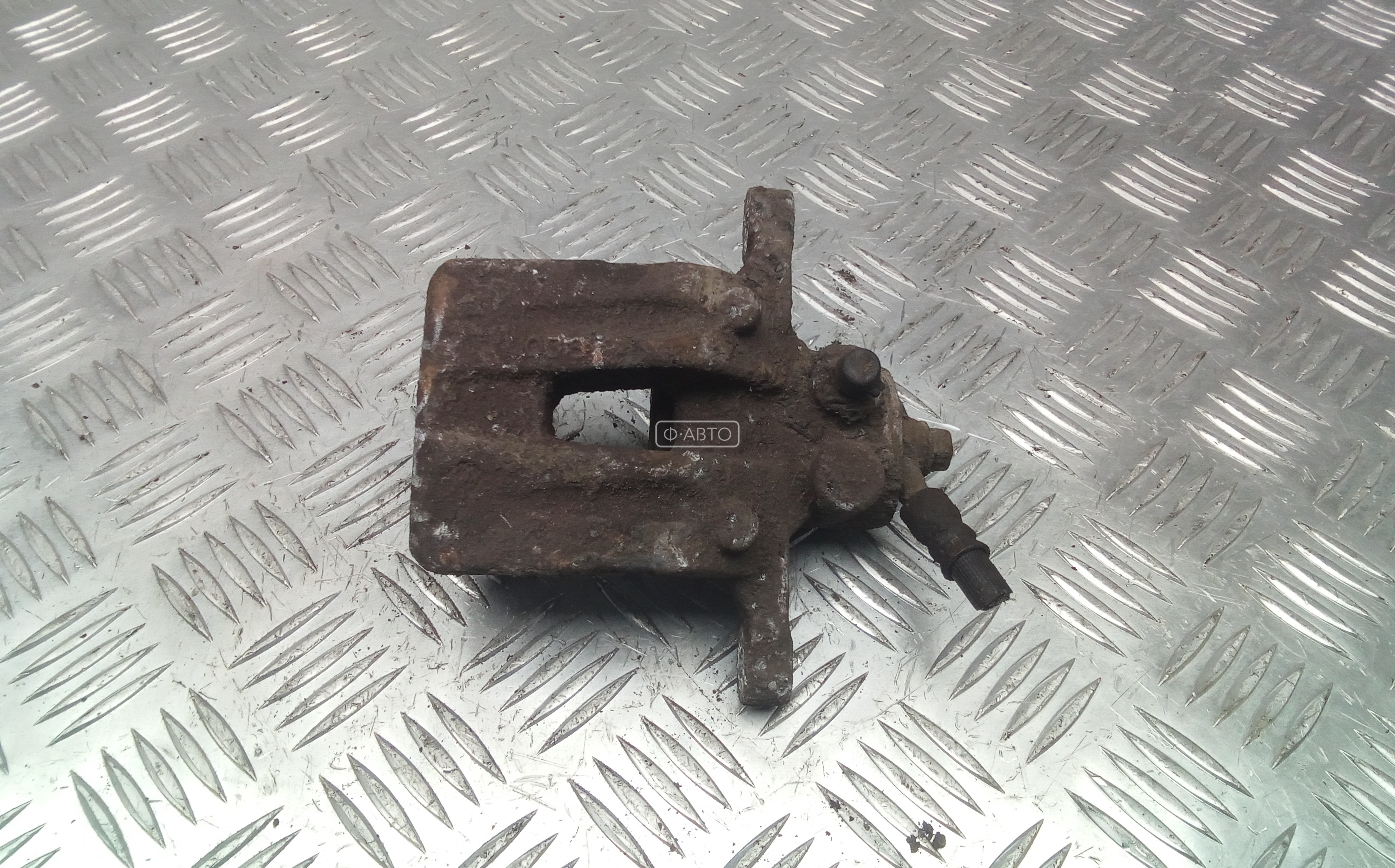 Суппорт тормозной задний левый