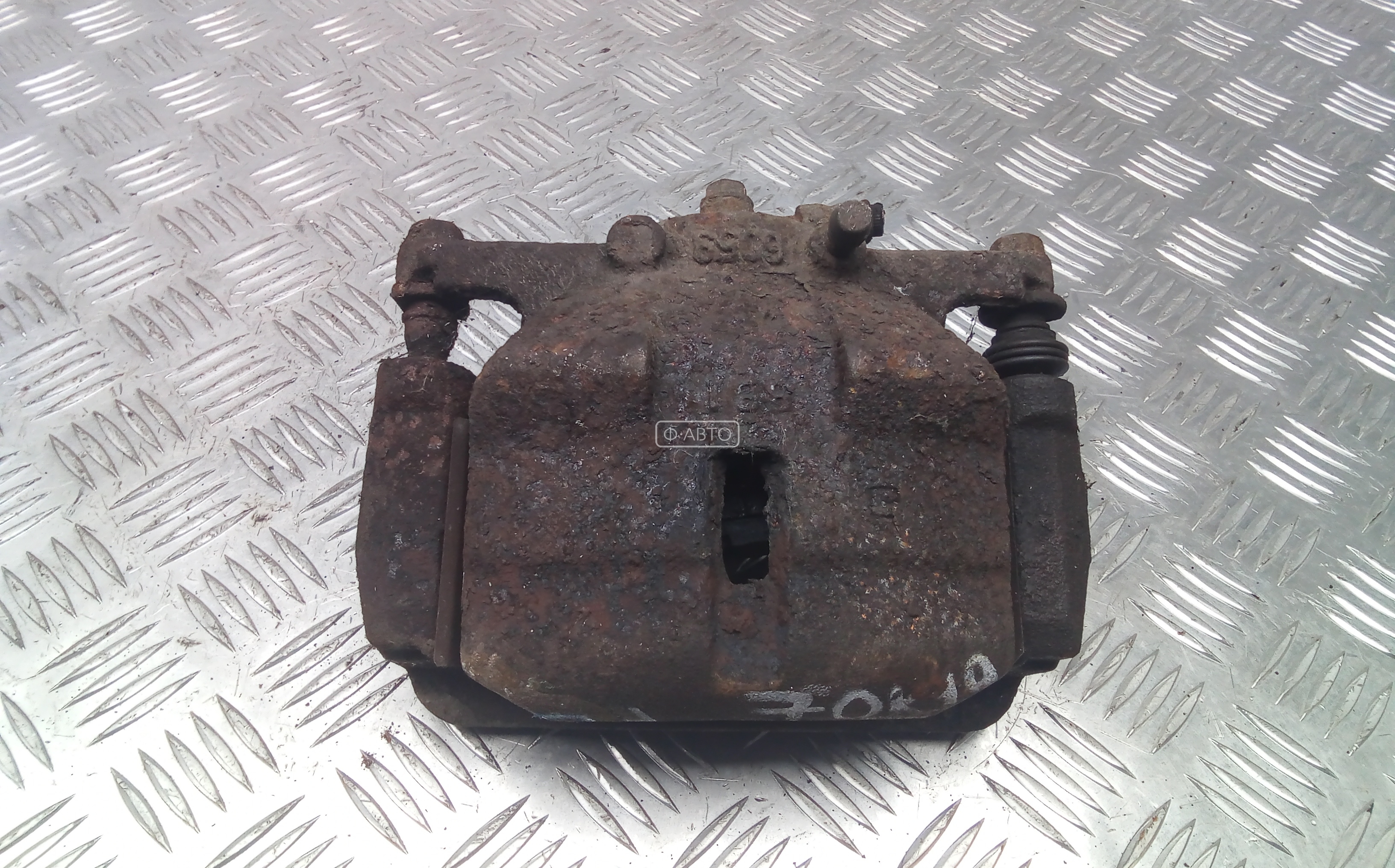 Суппорт тормозной передний левый