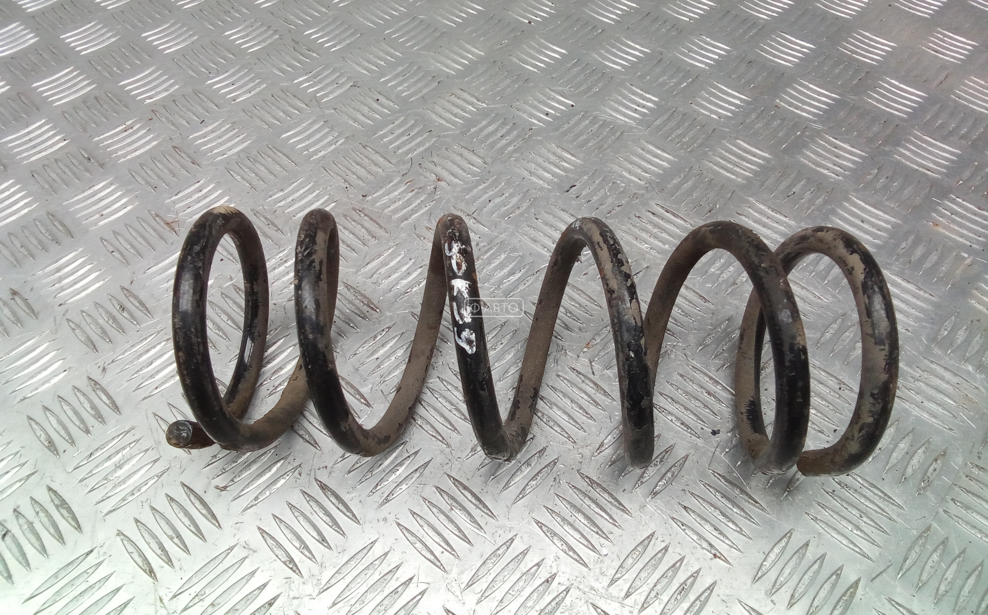 Пружина задняя