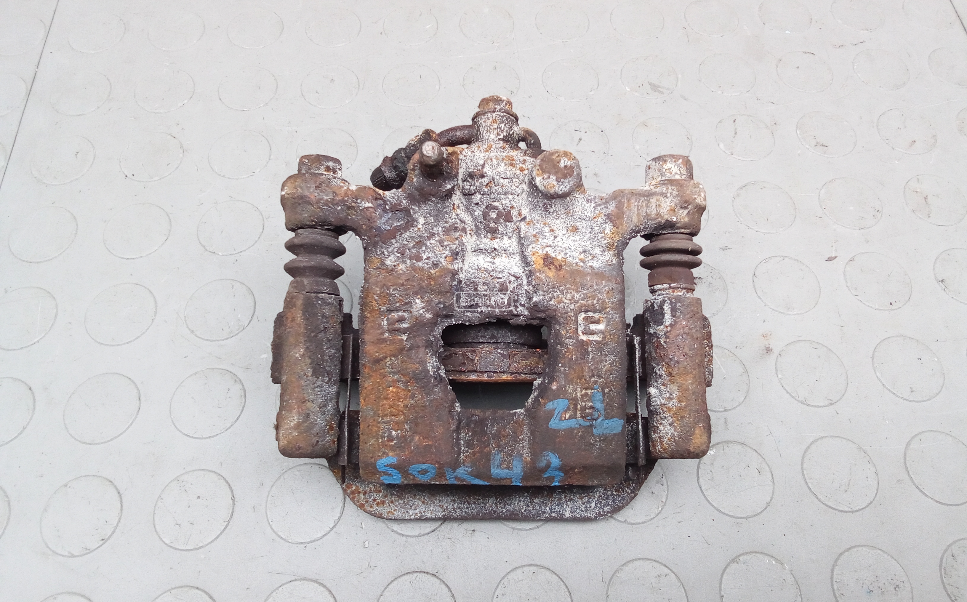 Суппорт тормозной задний левый