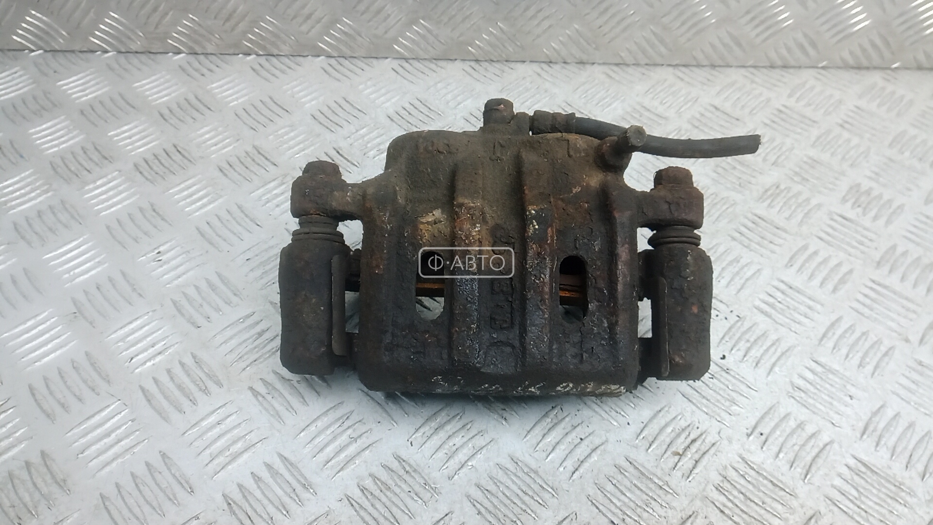 Суппорт тормозной передний левый