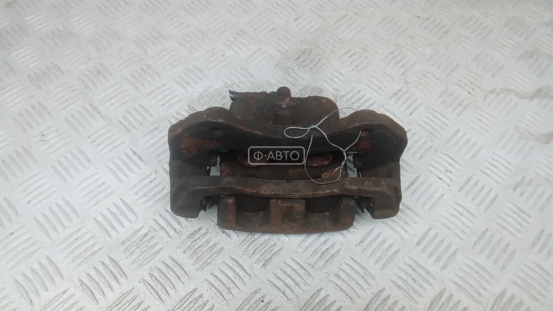 Суппорт тормозной передний левый