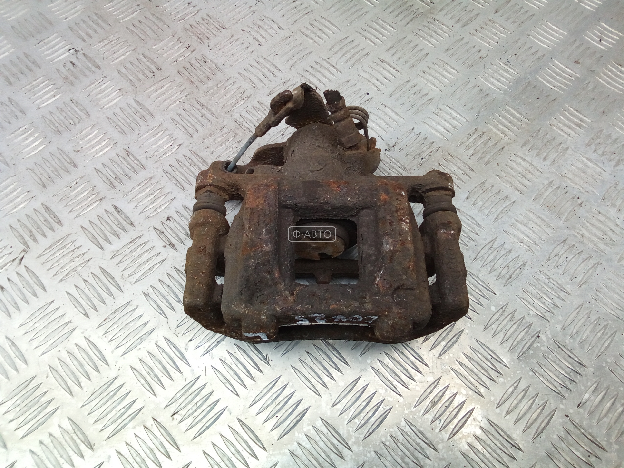 Суппорт тормозной задний левый