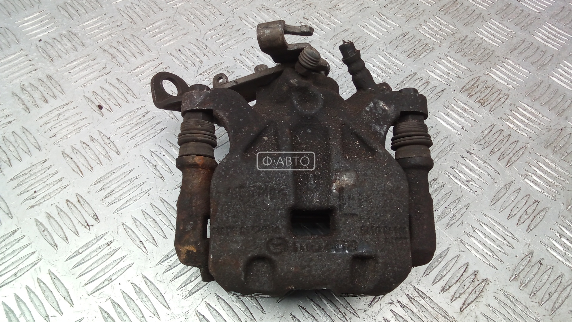 Суппорт тормозной задний левый