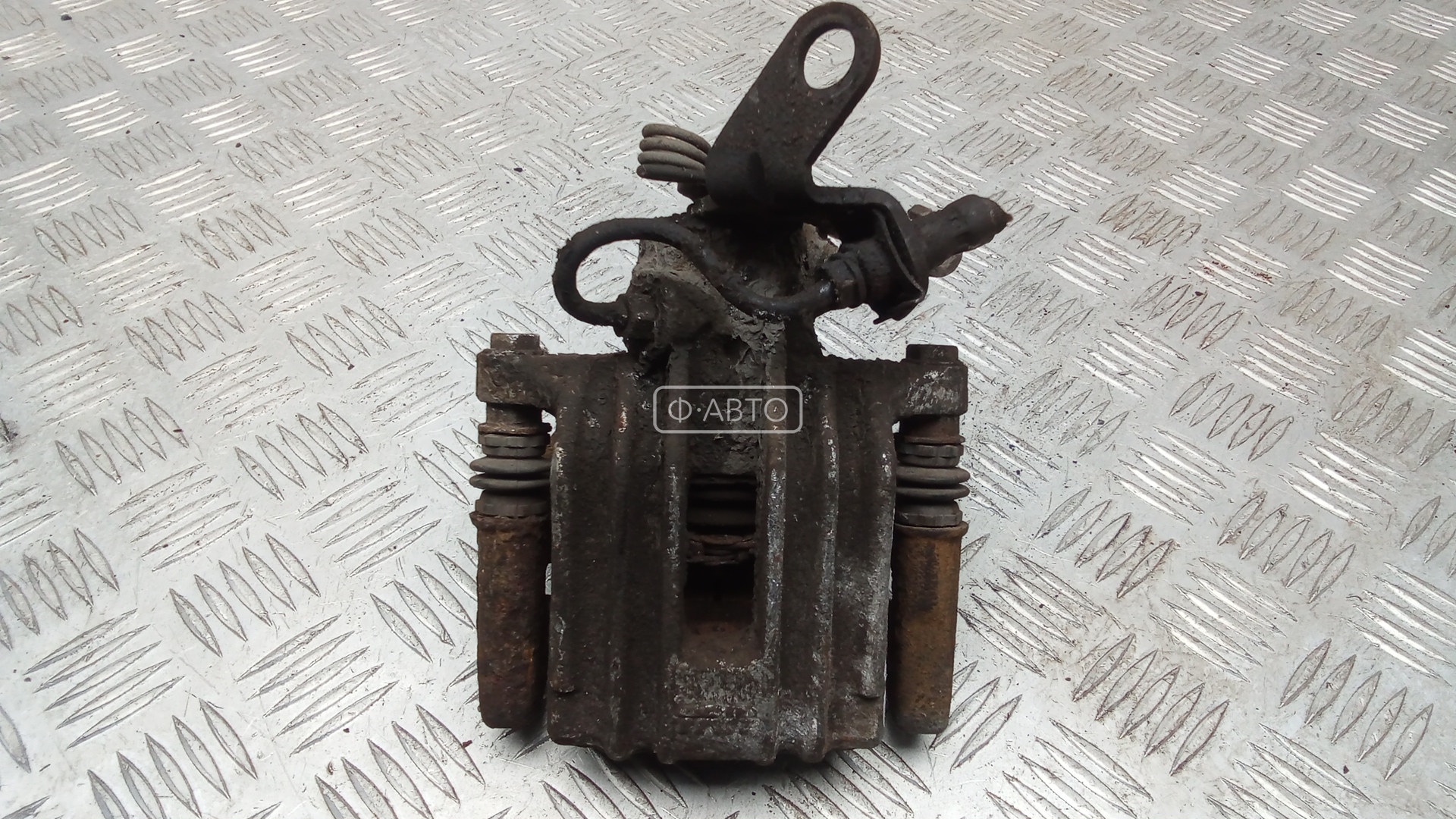 Суппорт тормозной задний левый