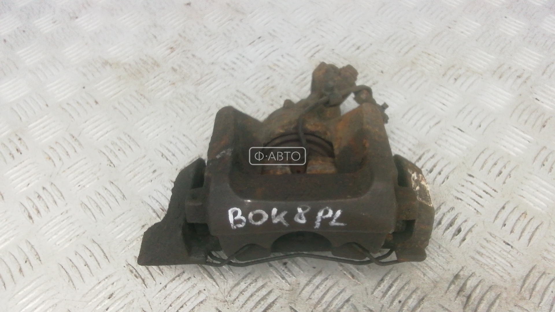 Суппорт тормозной передний левый