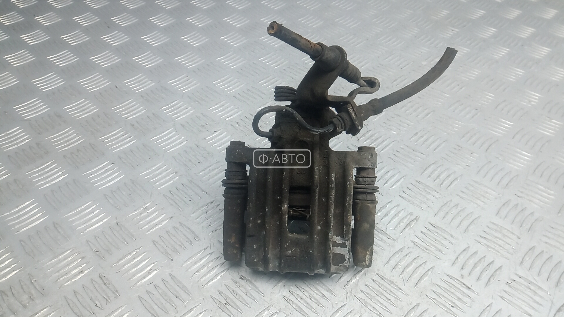 Суппорт тормозной задний левый