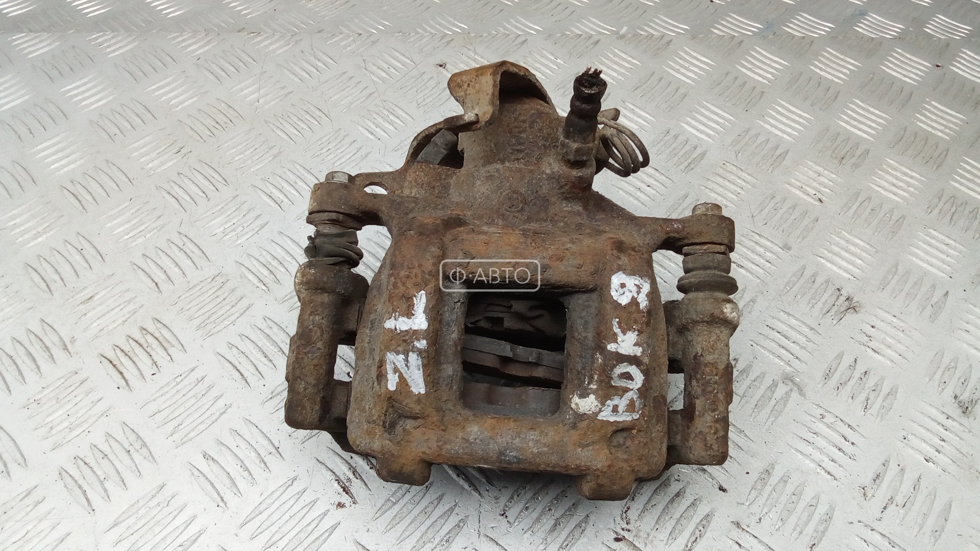 Суппорт тормозной задний левый