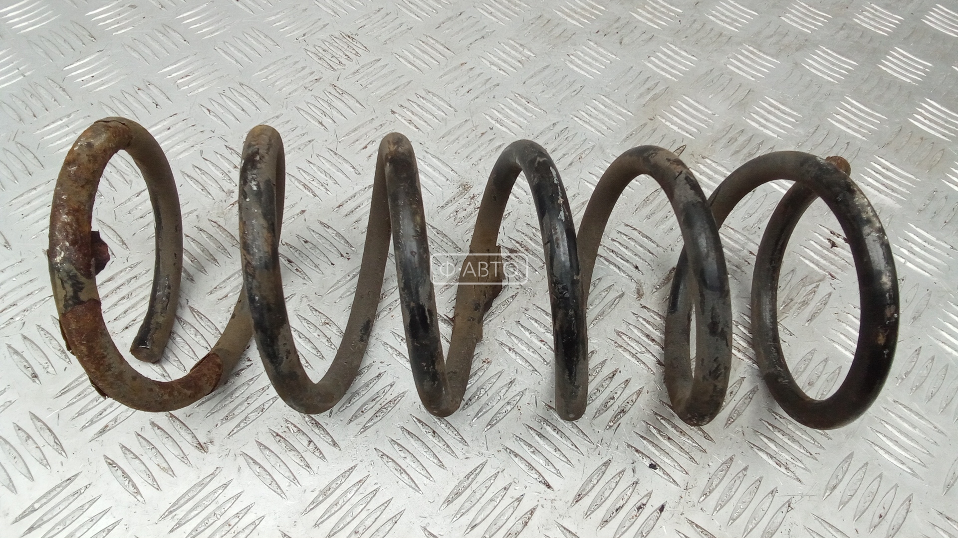 Пружина задняя