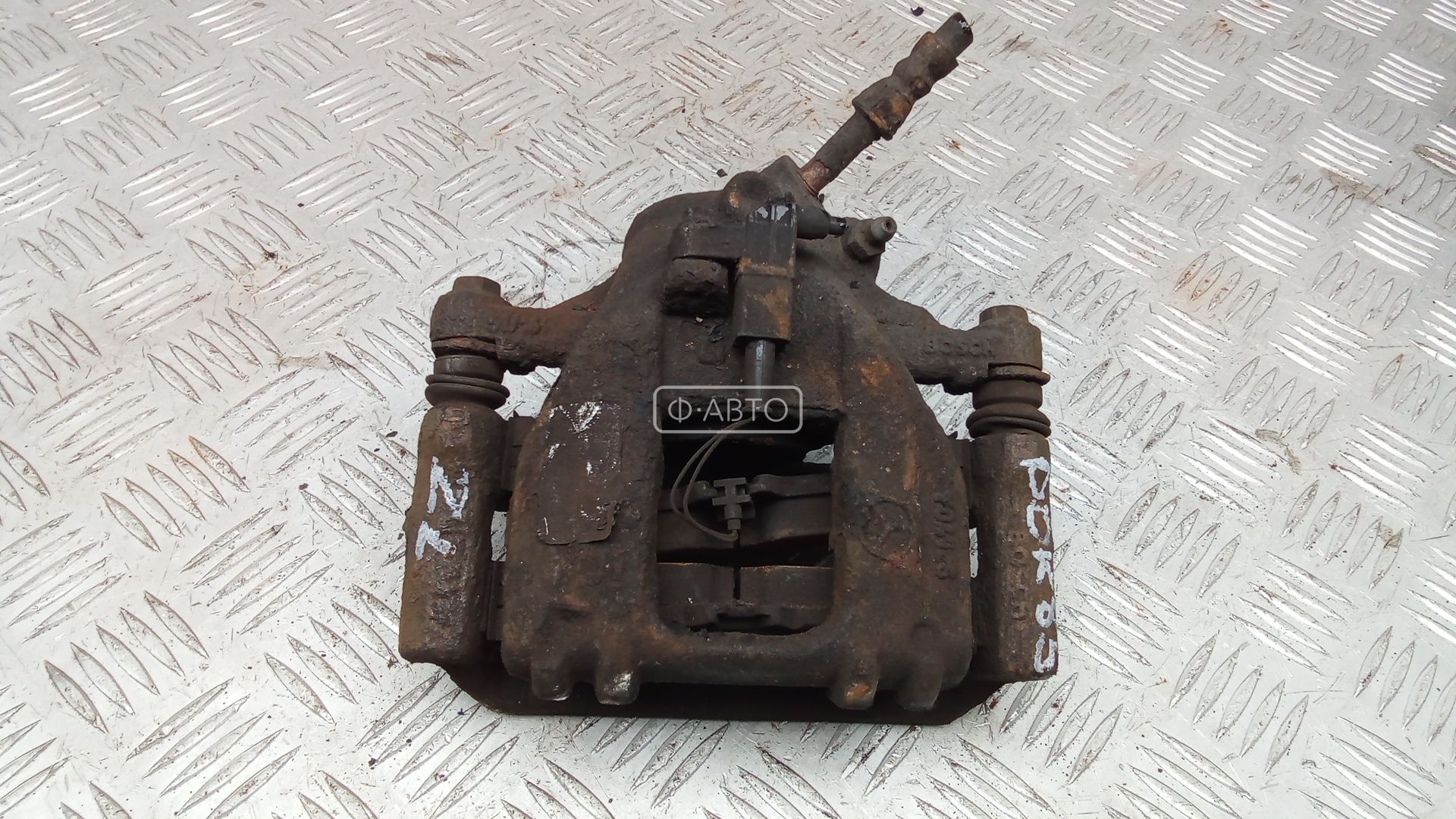 Суппорт тормозной задний левый