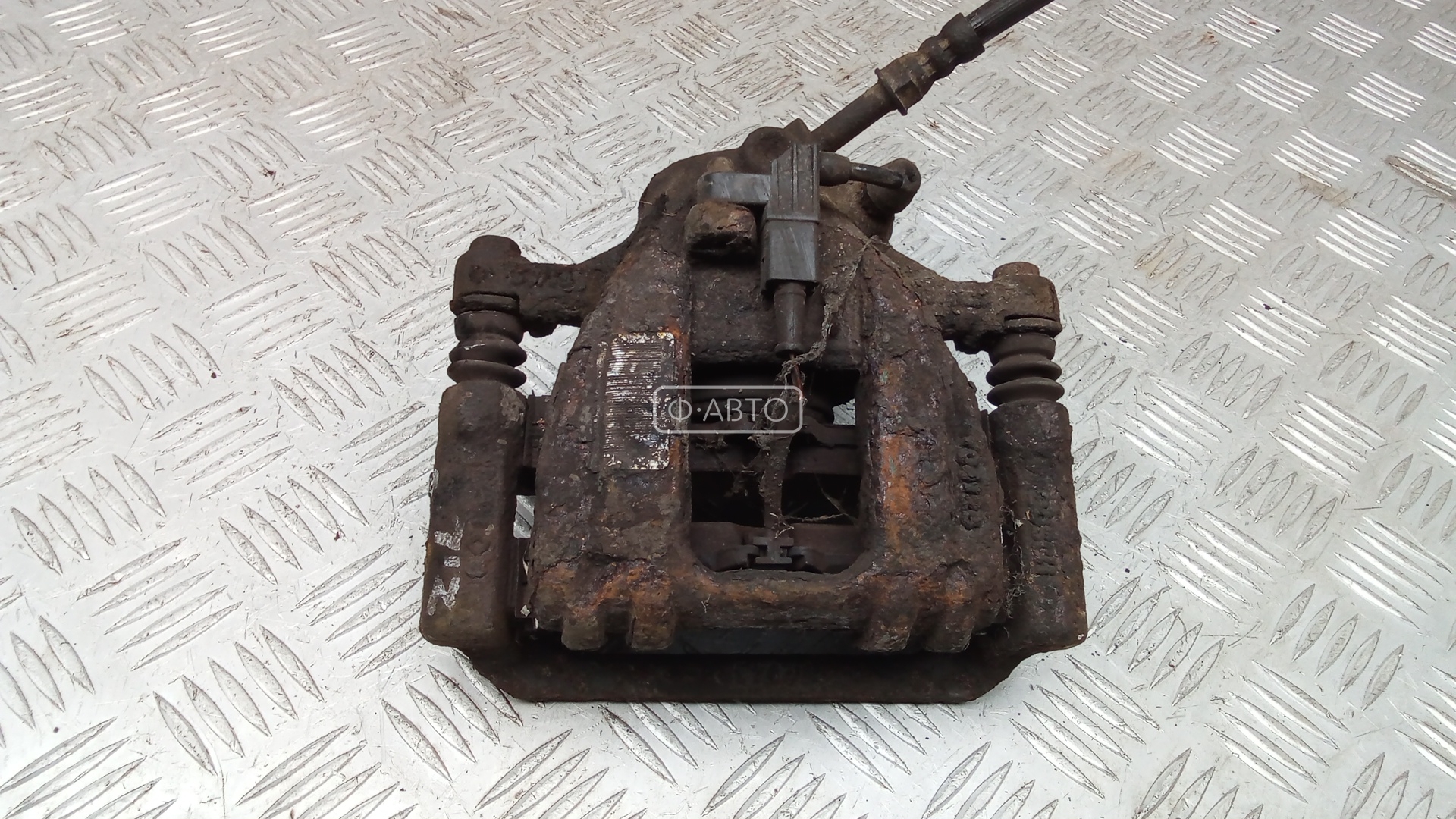 Суппорт тормозной задний левый