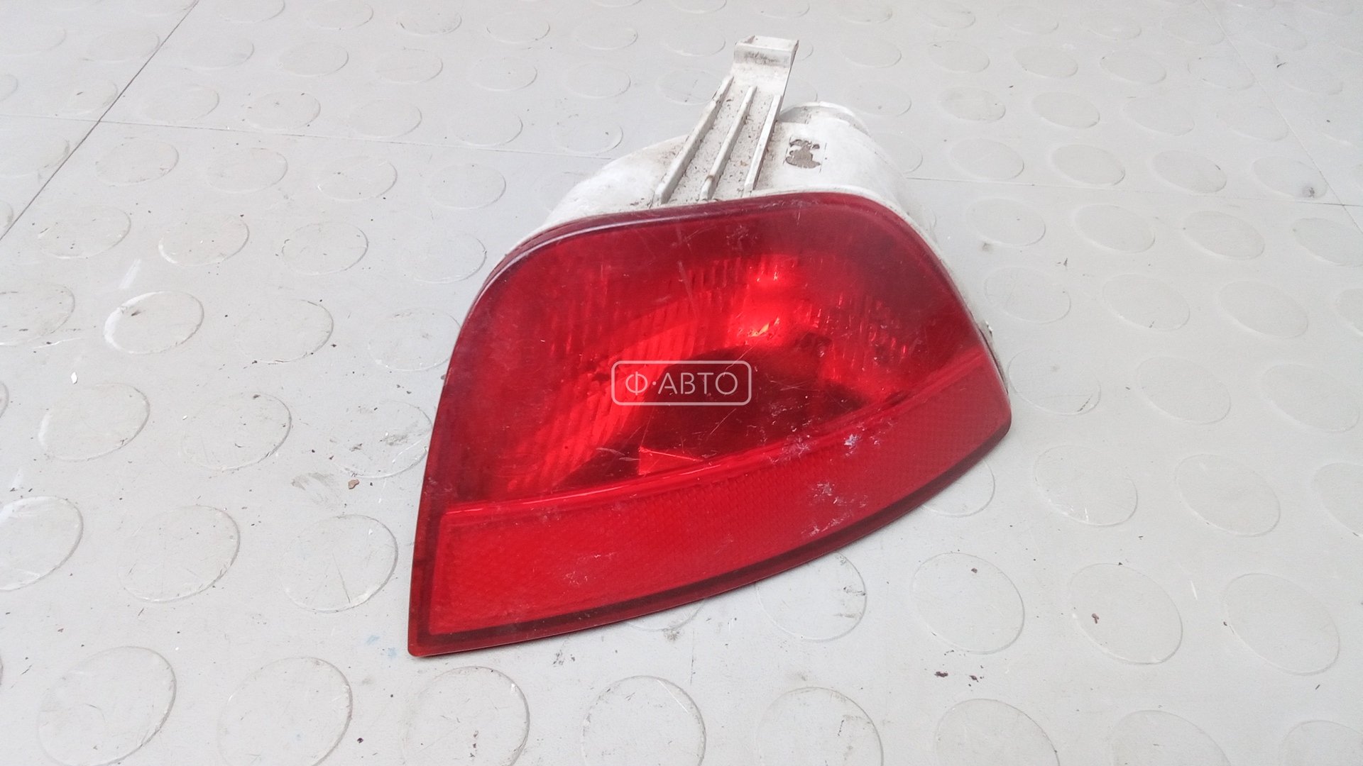 Фонарь бампера задний левый
