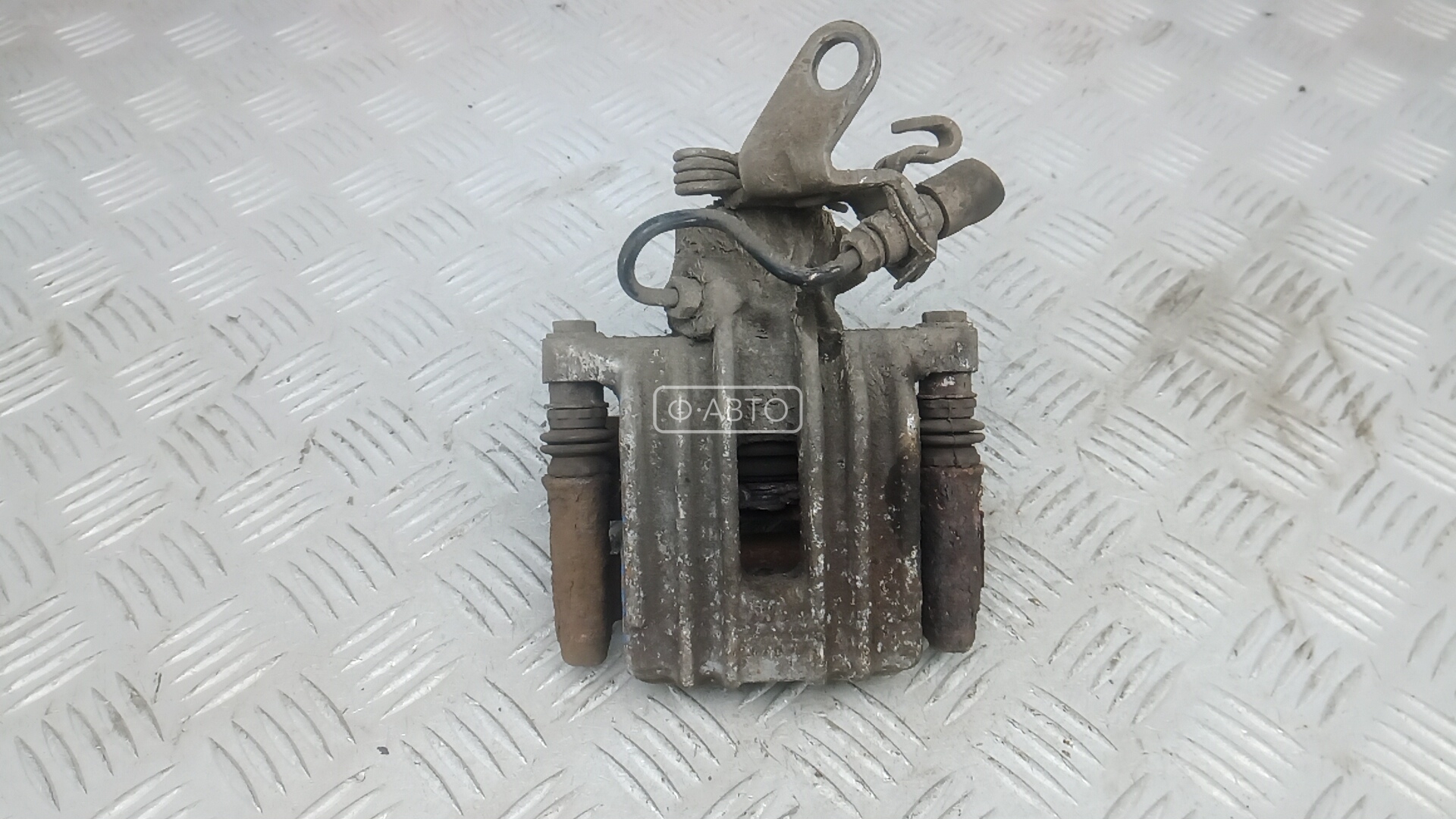 Суппорт тормозной задний левый