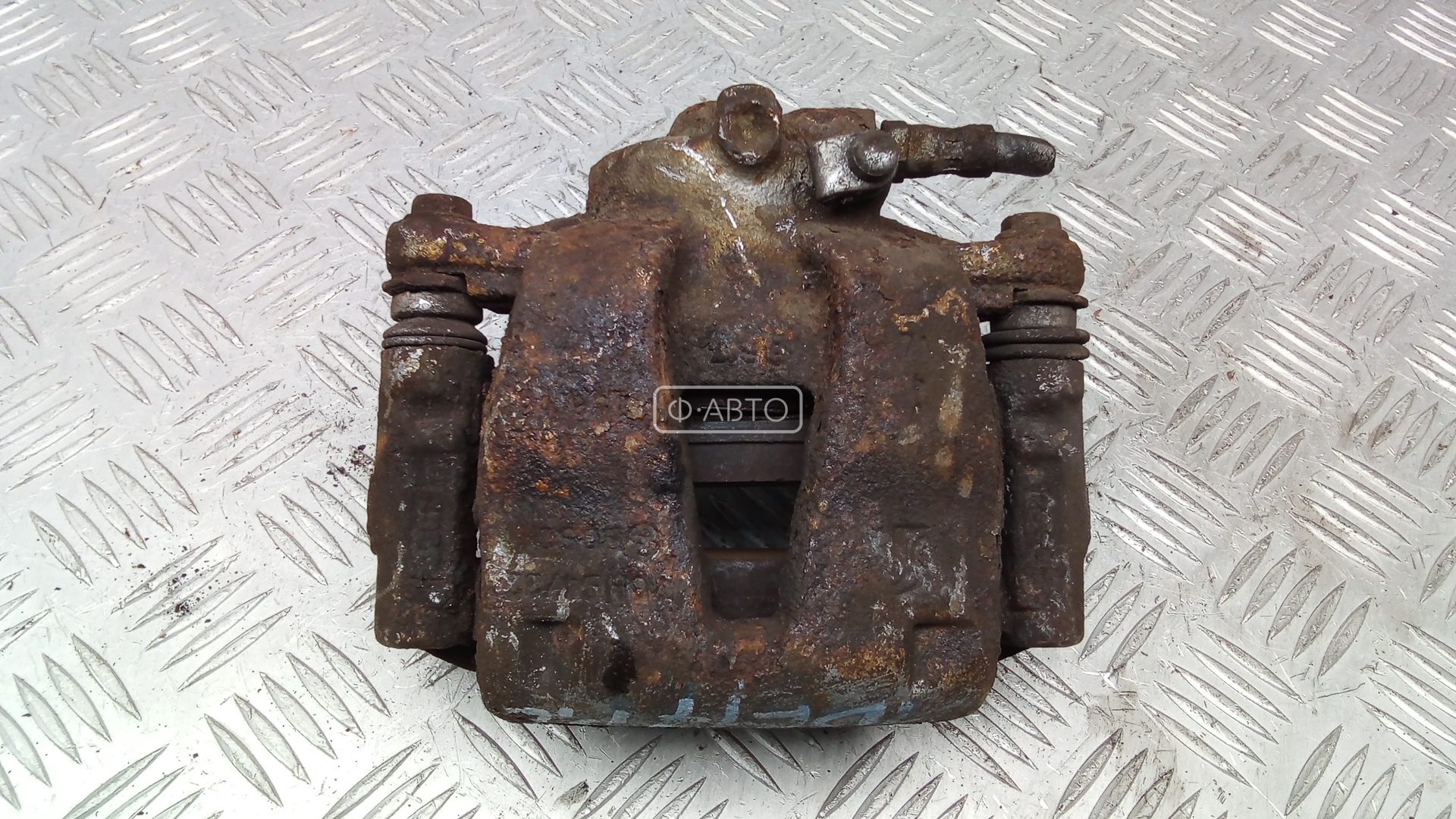 Суппорт тормозной передний левый