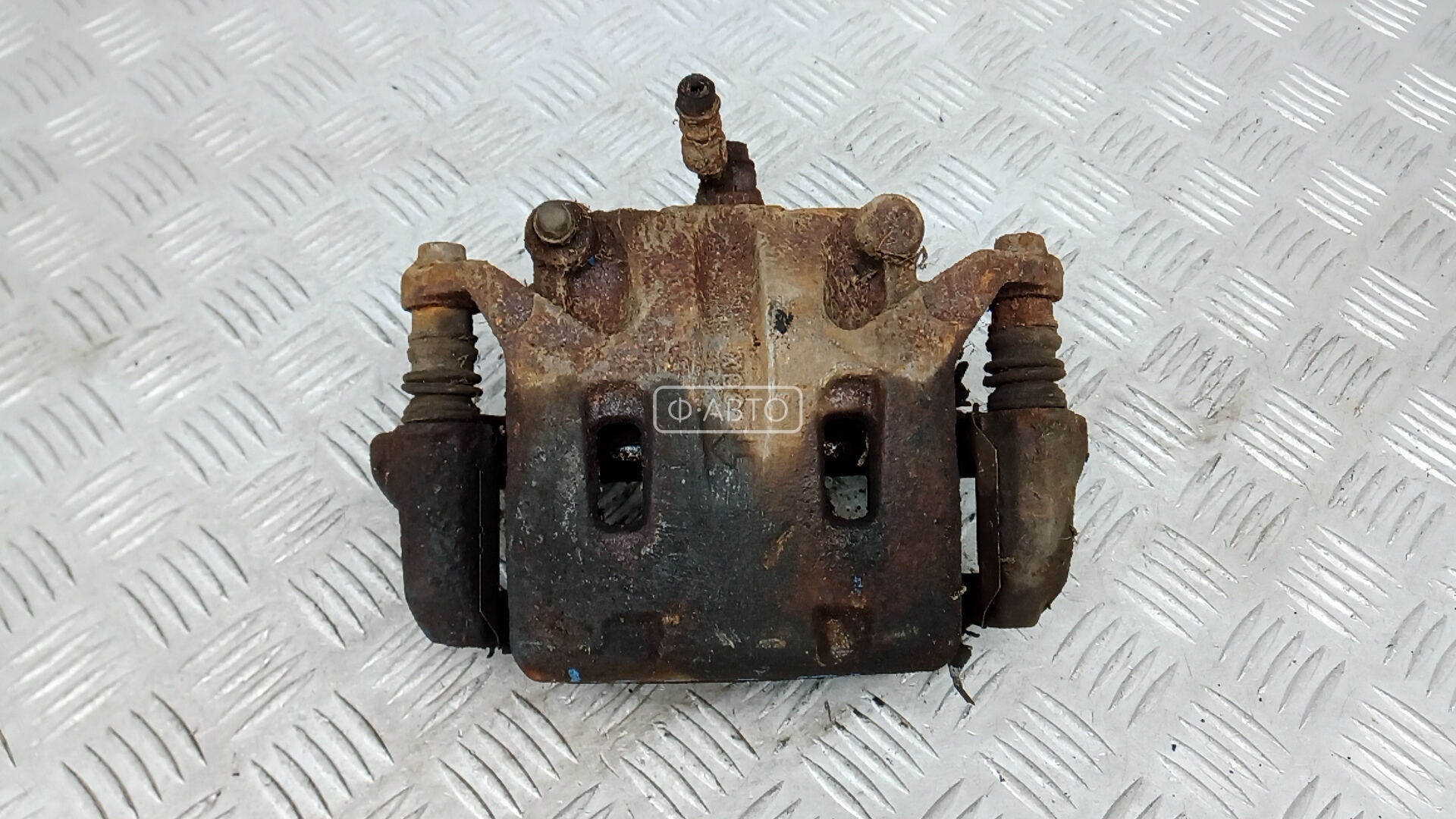 Суппорт тормозной передний левый