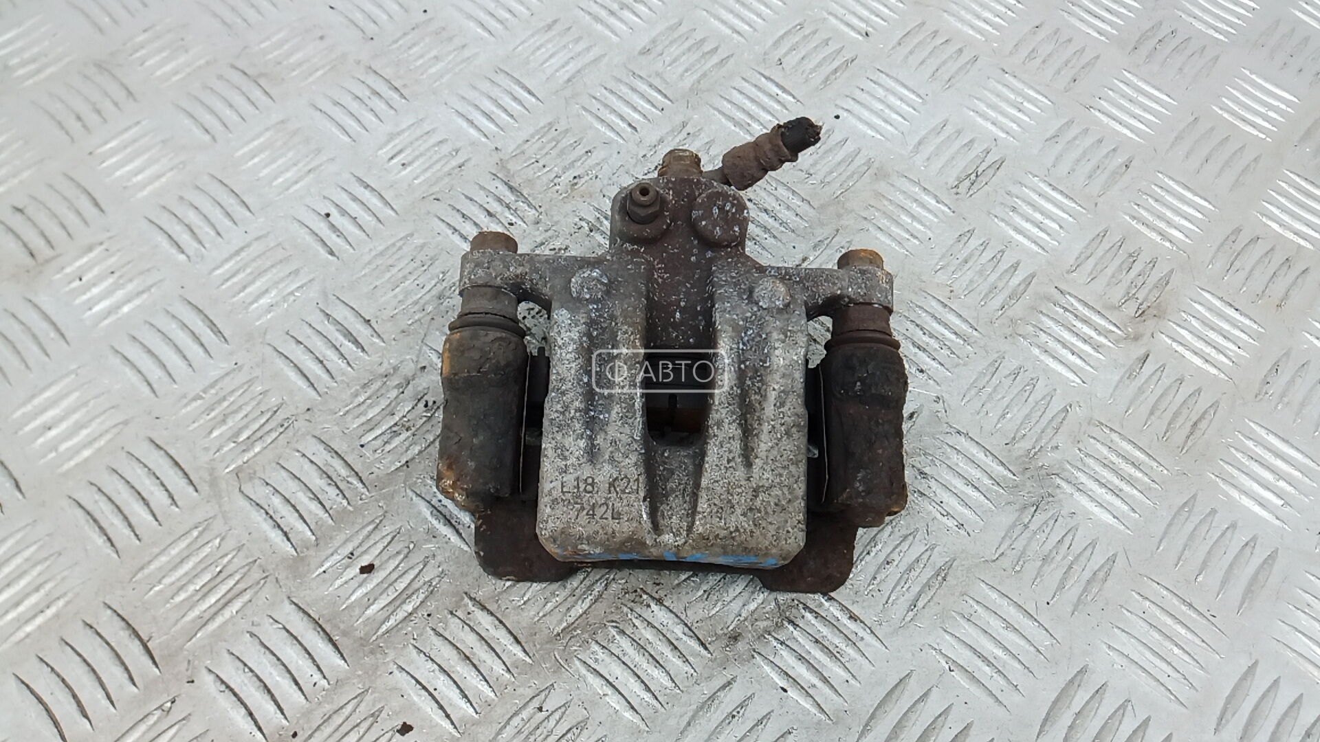 Суппорт тормозной задний левый