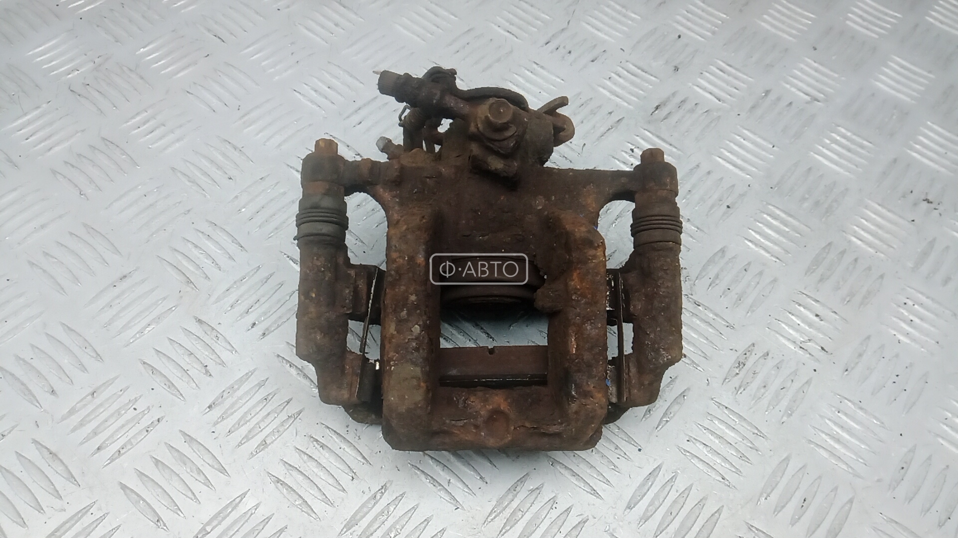 Суппорт тормозной задний левый