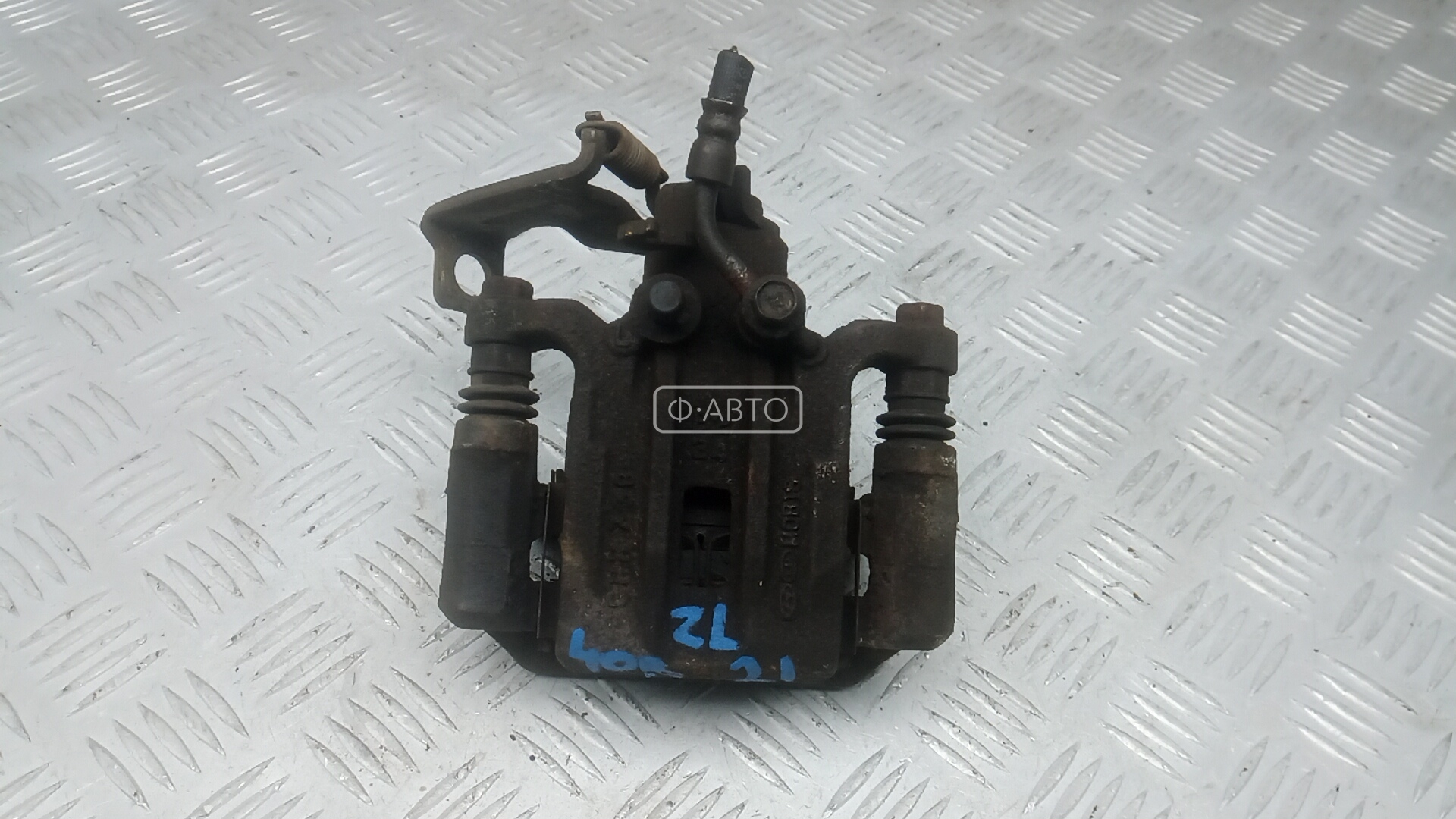 Суппорт тормозной задний левый