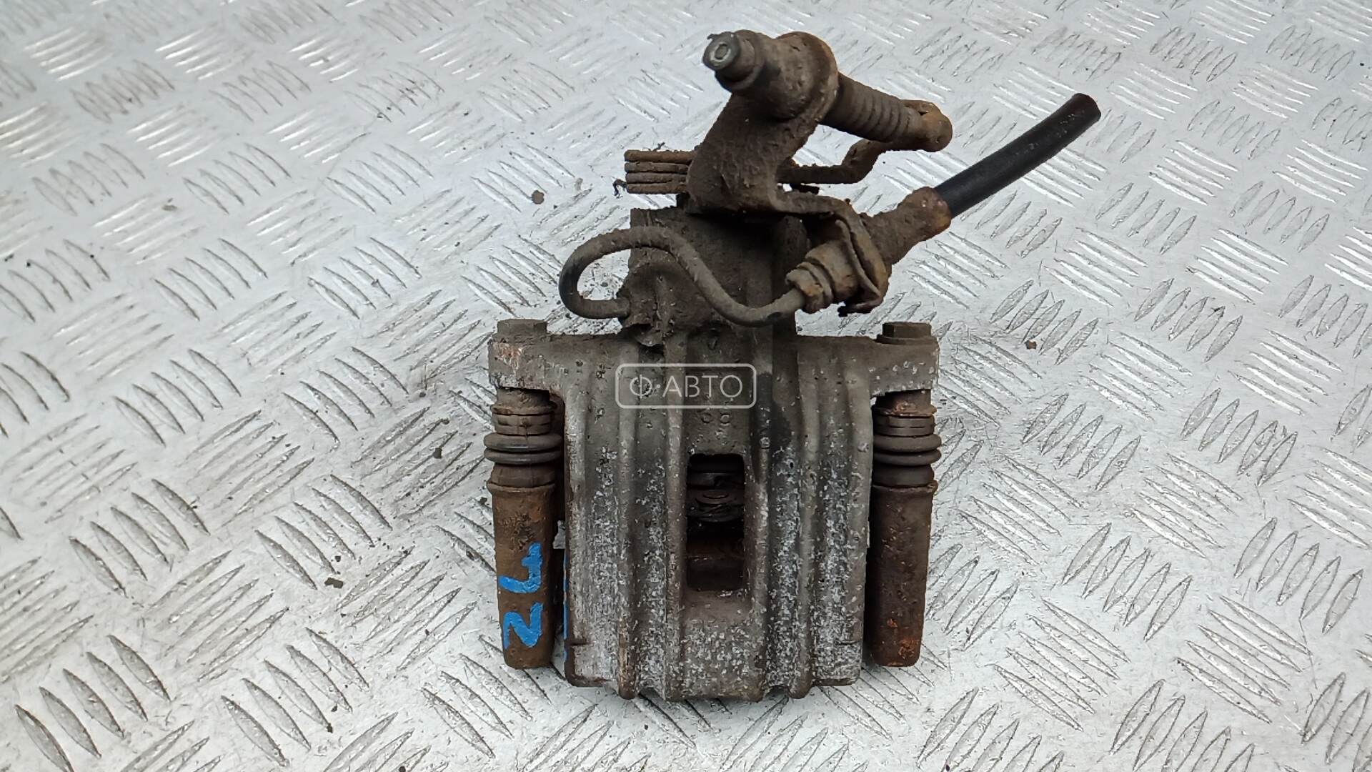 Суппорт тормозной задний левый