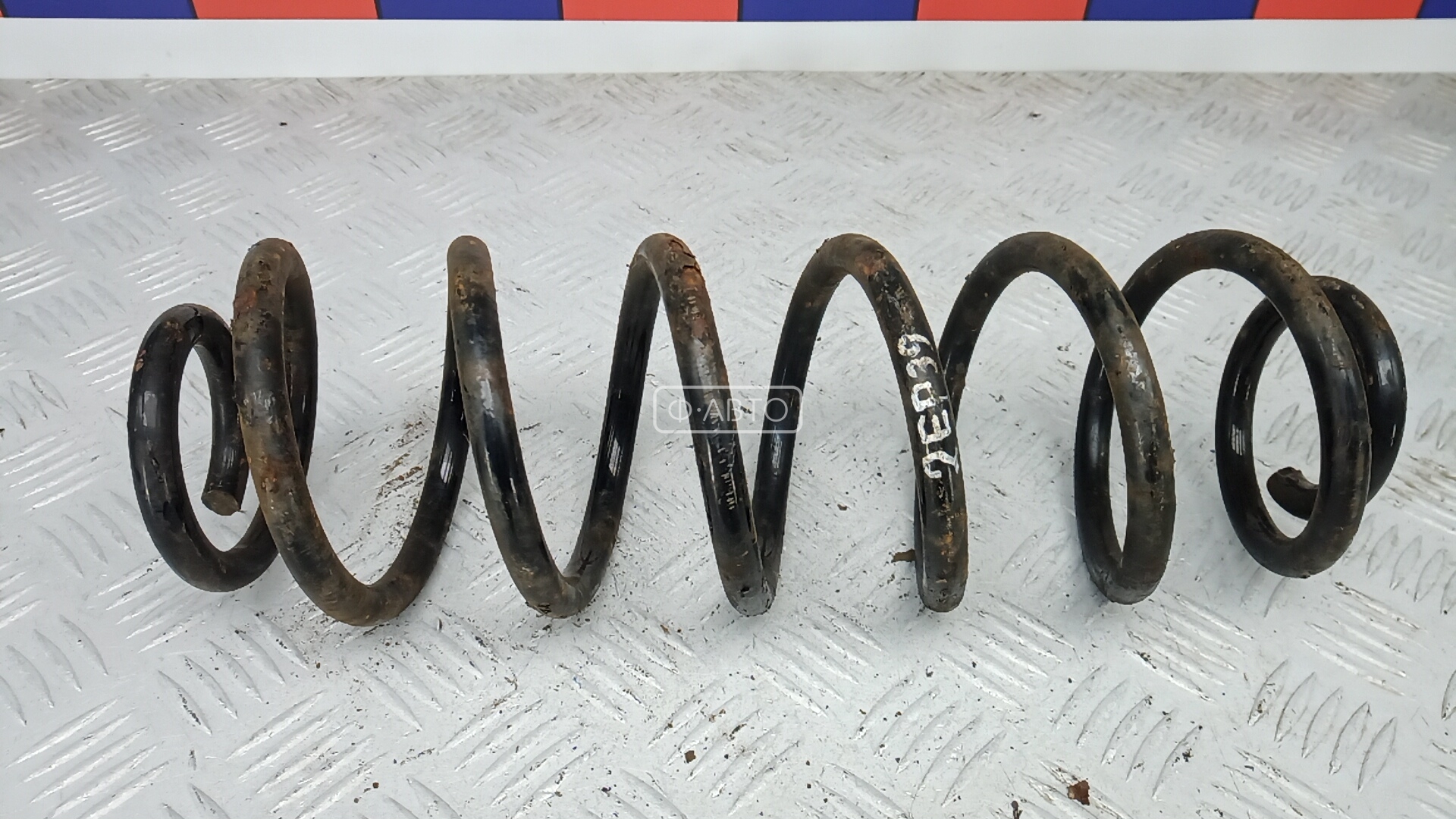 Пружина задняя