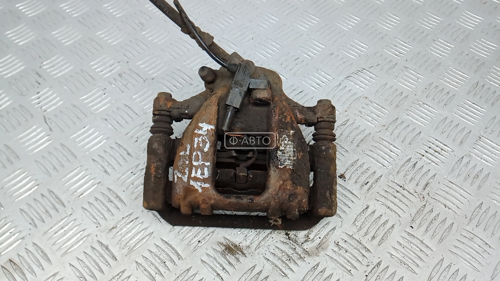 Суппорт тормозной задний левый