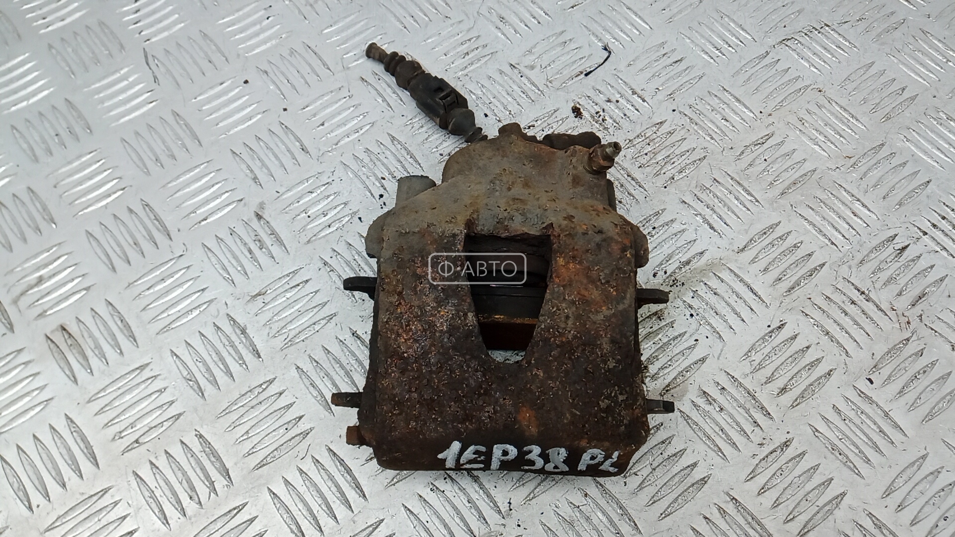 Суппорт тормозной передний левый