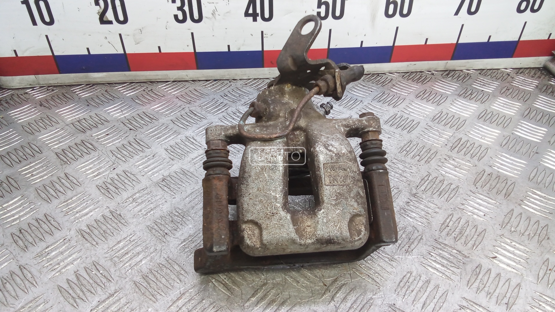 Суппорт тормозной задний левый