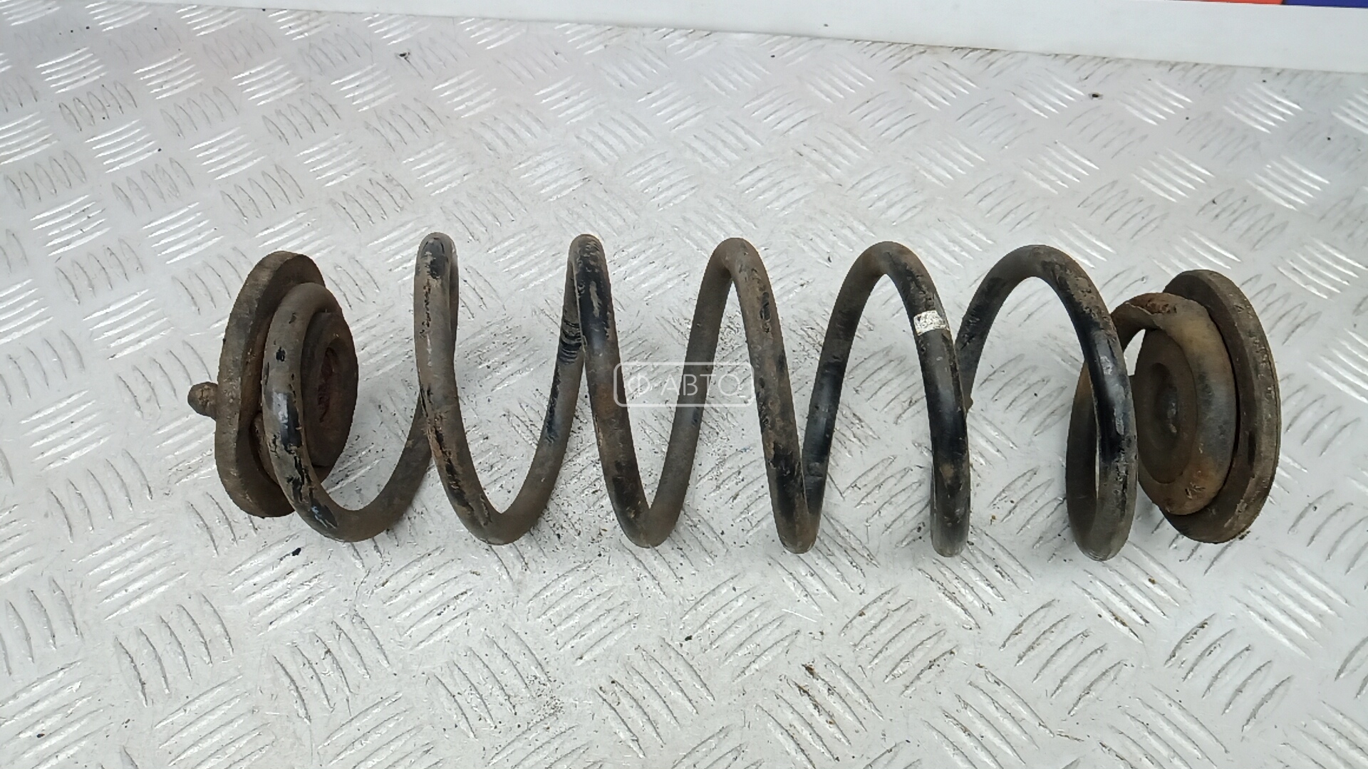 Пружина задняя