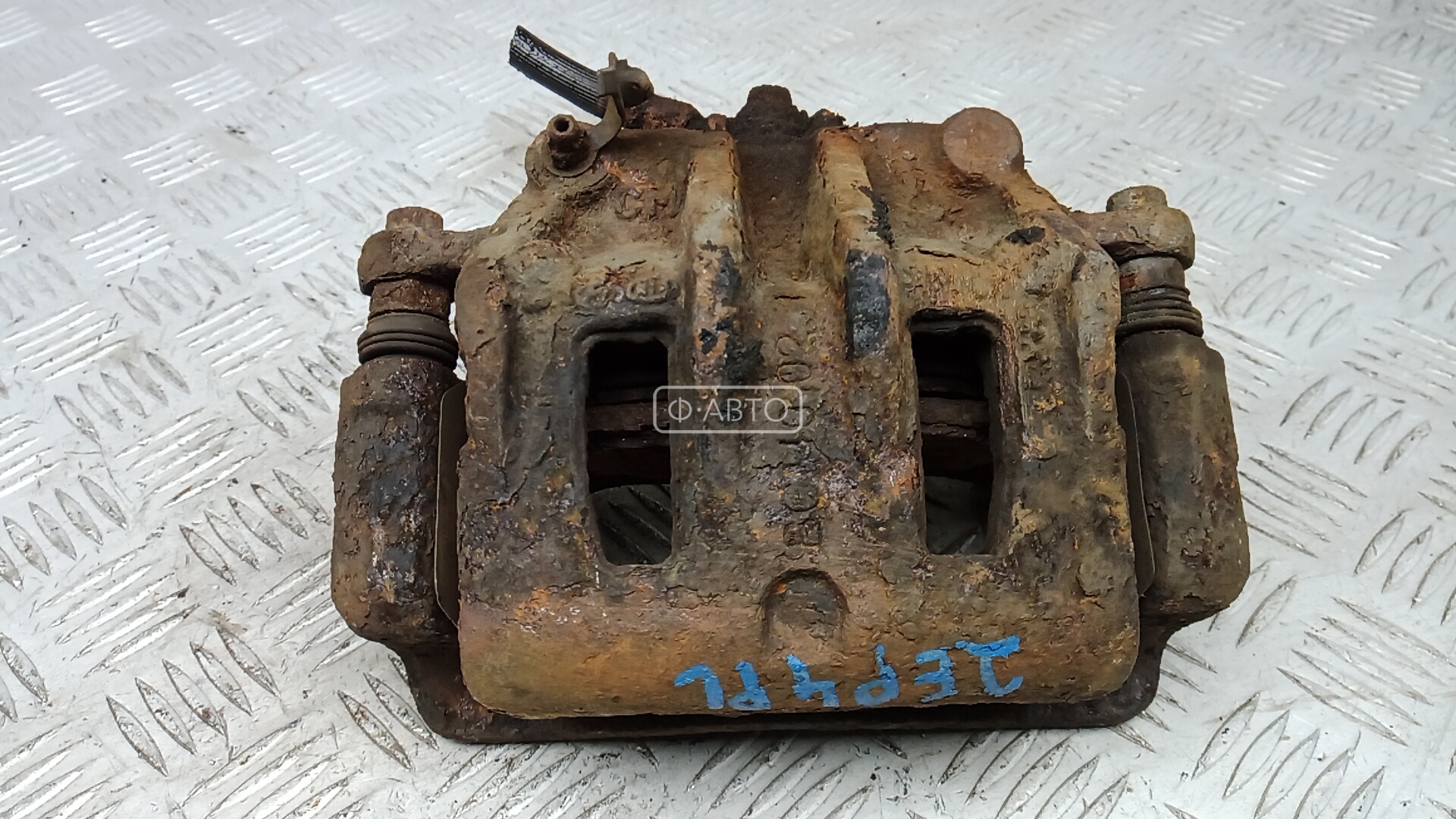 Суппорт тормозной передний левый