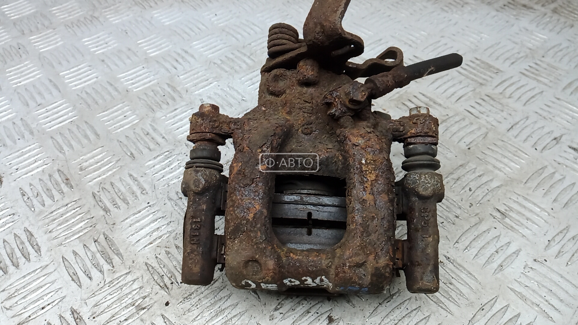 Суппорт тормозной задний левый