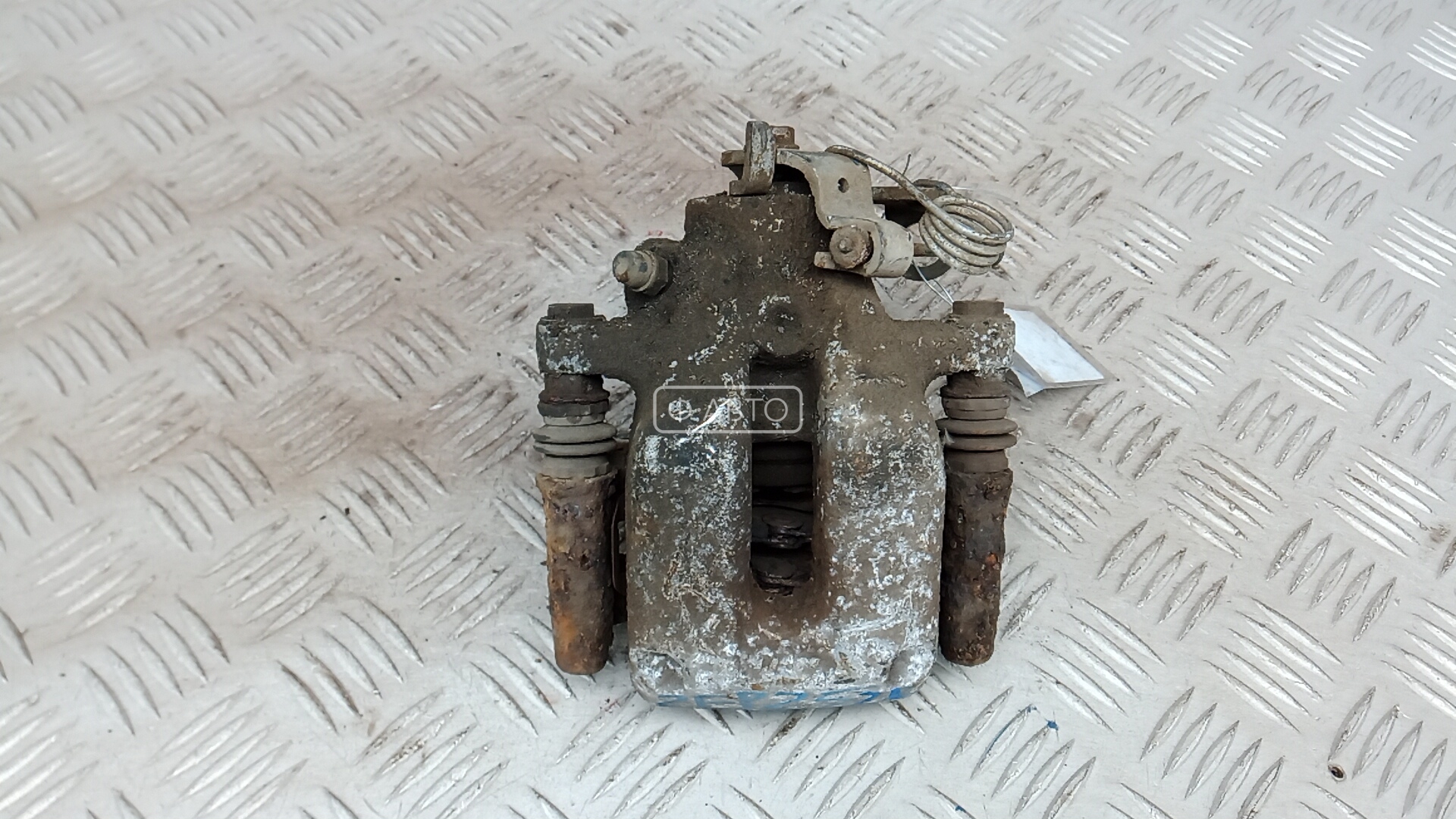 Суппорт тормозной задний левый