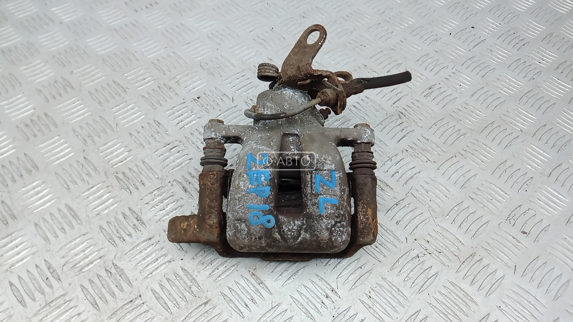 Суппорт тормозной задний левый