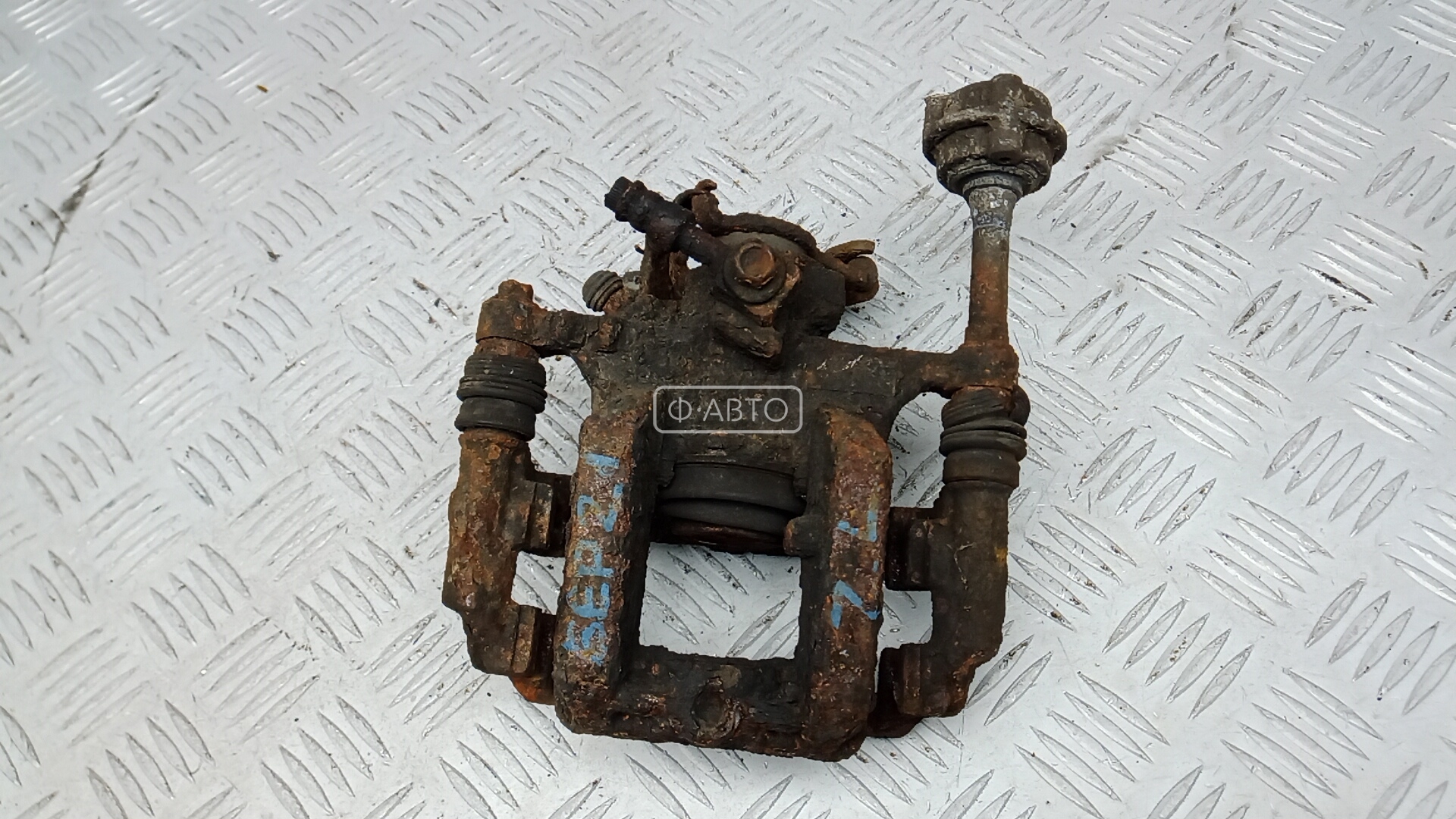 Суппорт тормозной задний левый OPEL ASTRA J