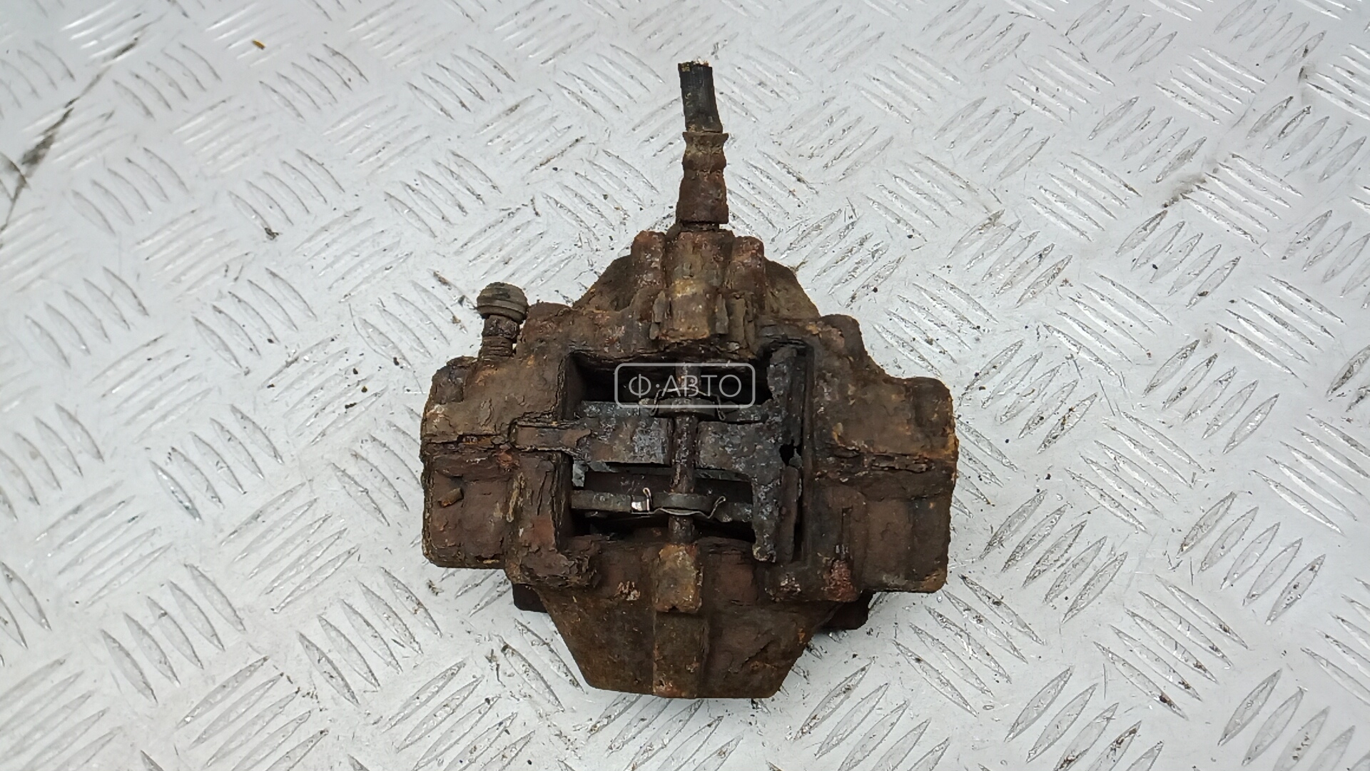 Суппорт тормозной задний левый