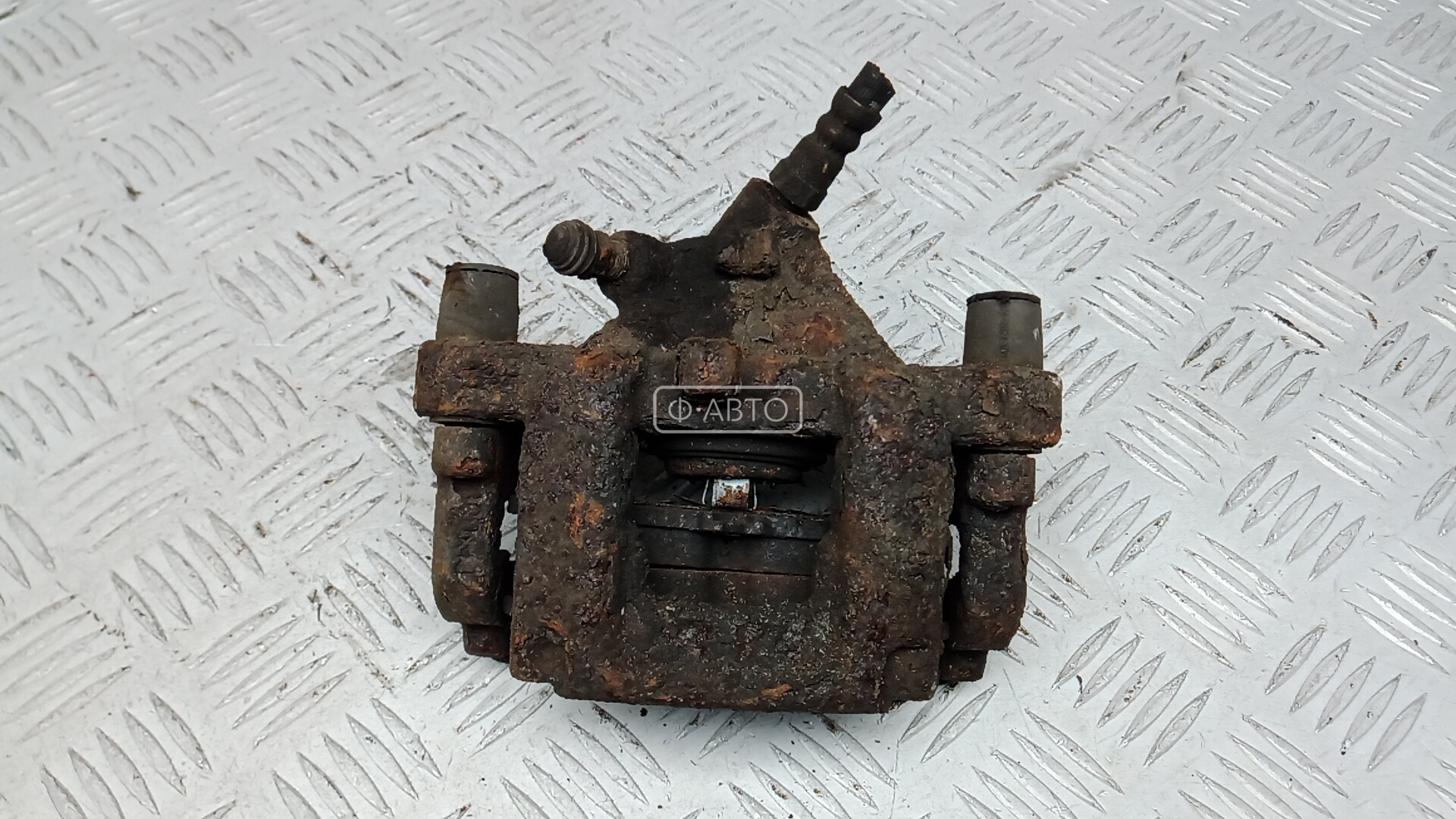 Суппорт тормозной задний левый