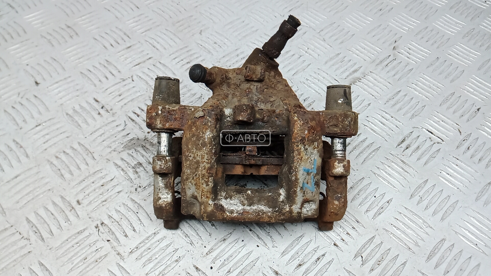 Суппорт тормозной задний левый