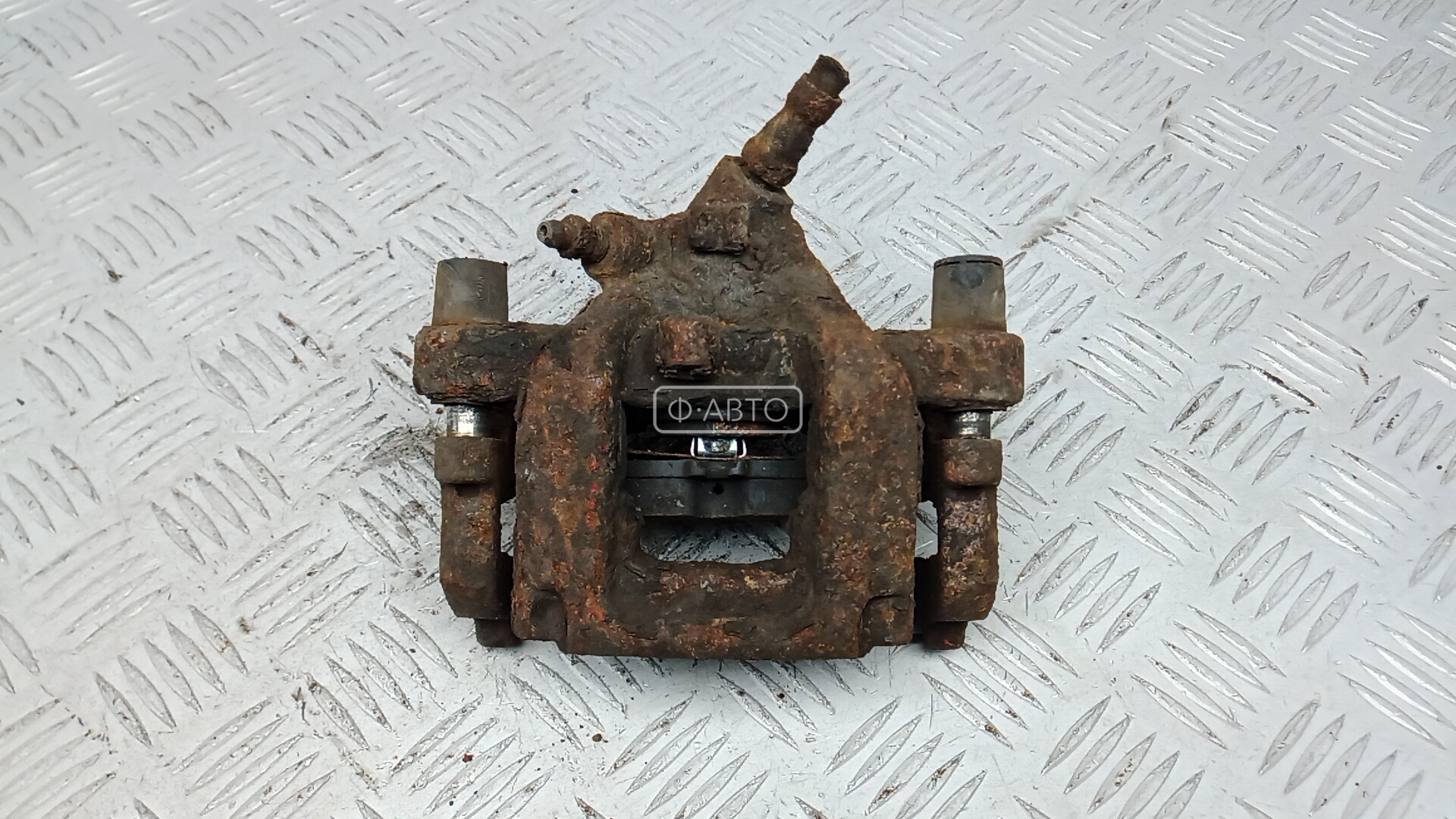 Суппорт тормозной задний левый