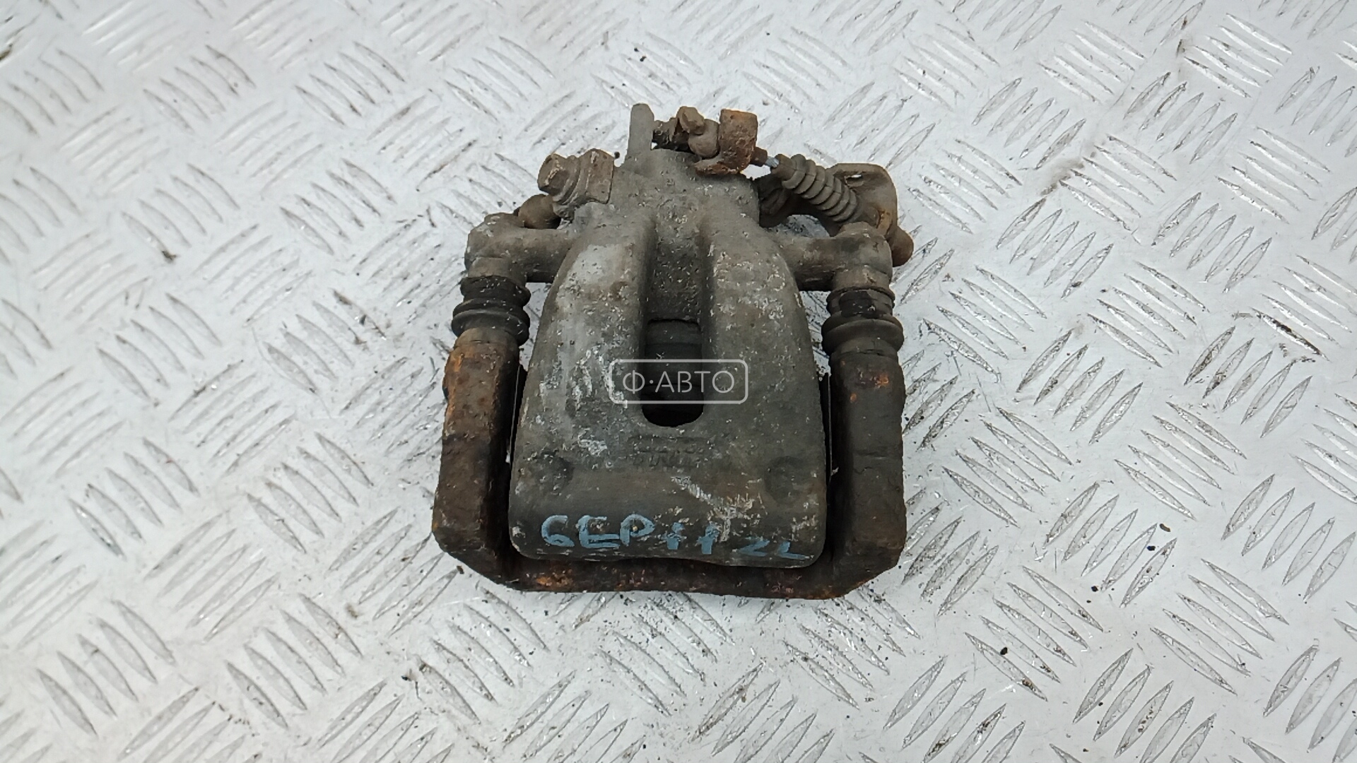 Суппорт тормозной задний левый
