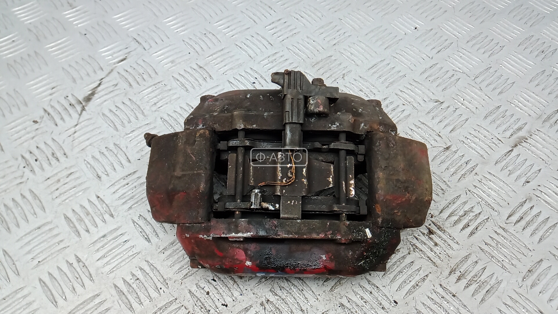 Суппорт тормозной передний левый