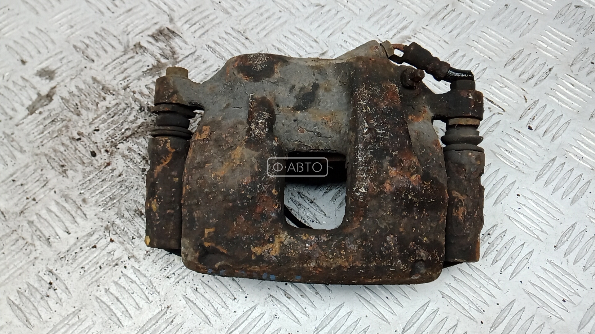 Суппорт тормозной передний левый