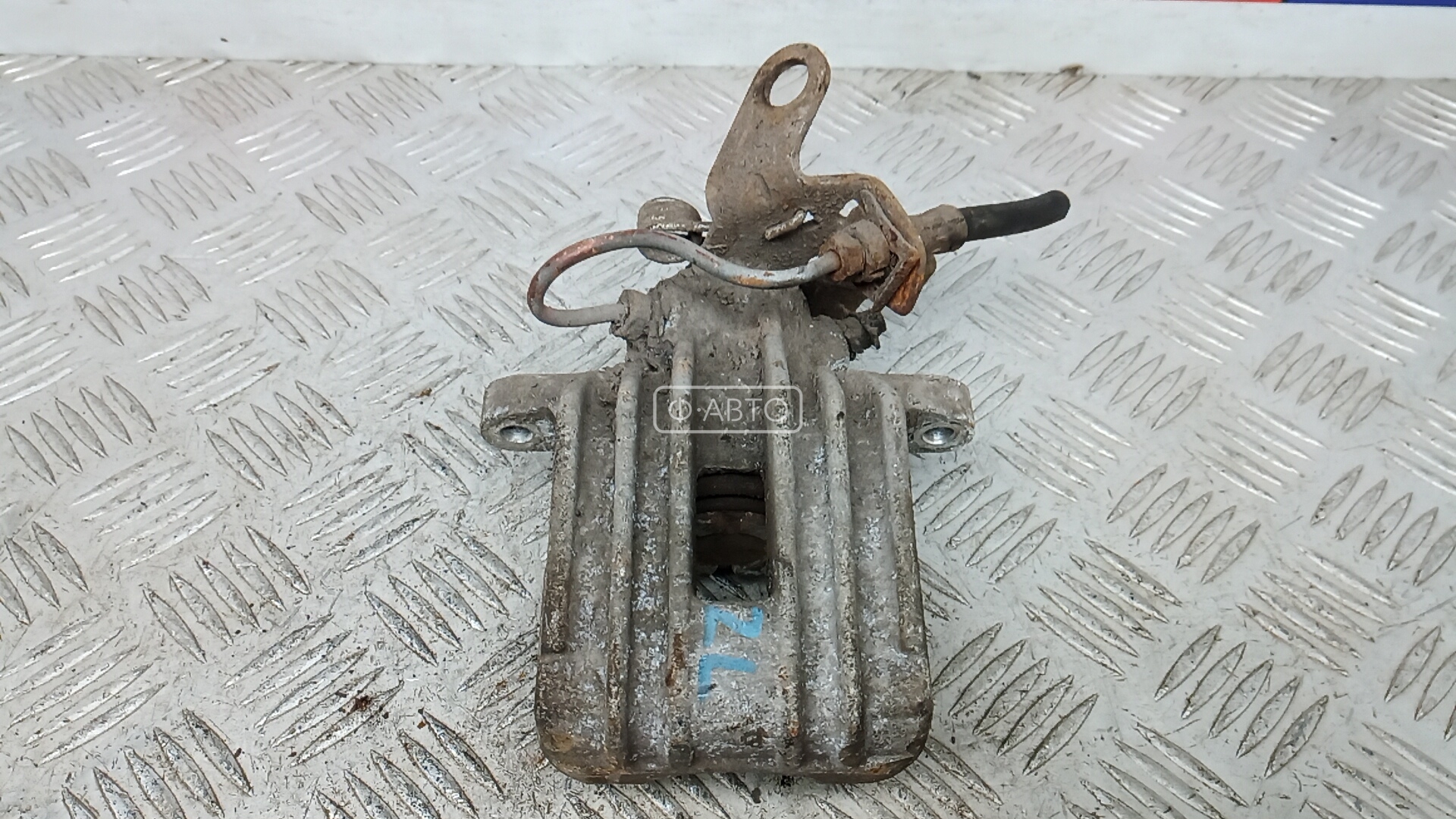 Суппорт тормозной задний левый