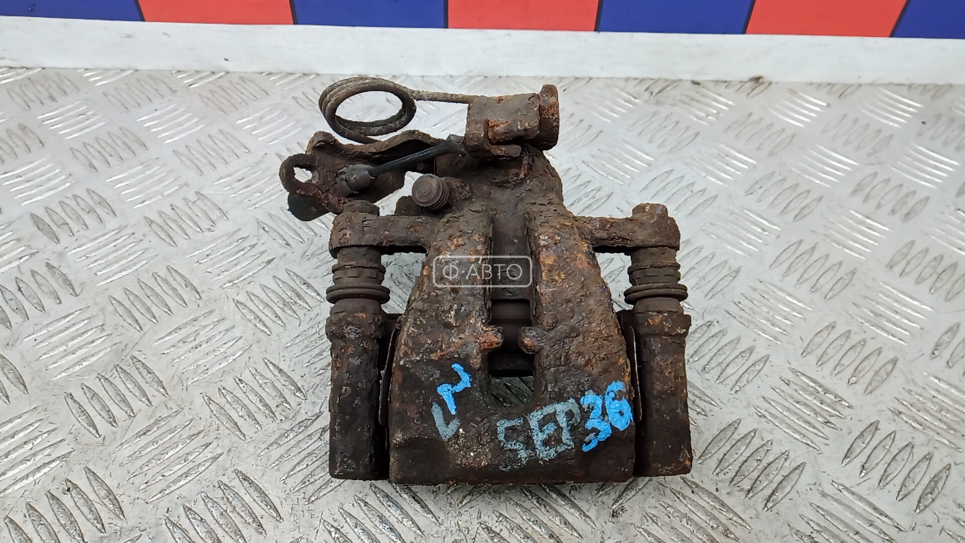 Суппорт тормозной задний левый