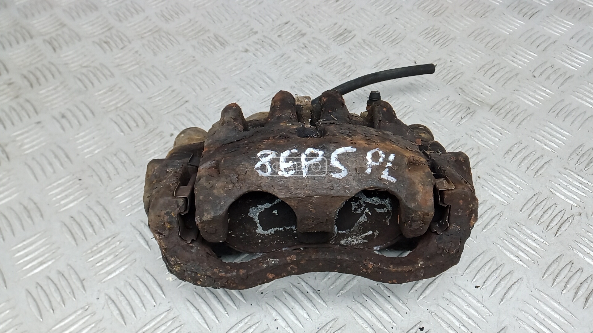 Суппорт тормозной передний левый