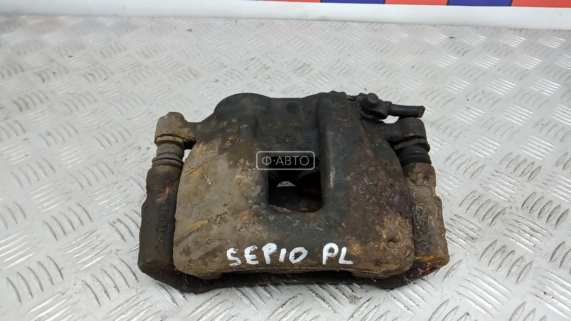 Суппорт тормозной передний левый