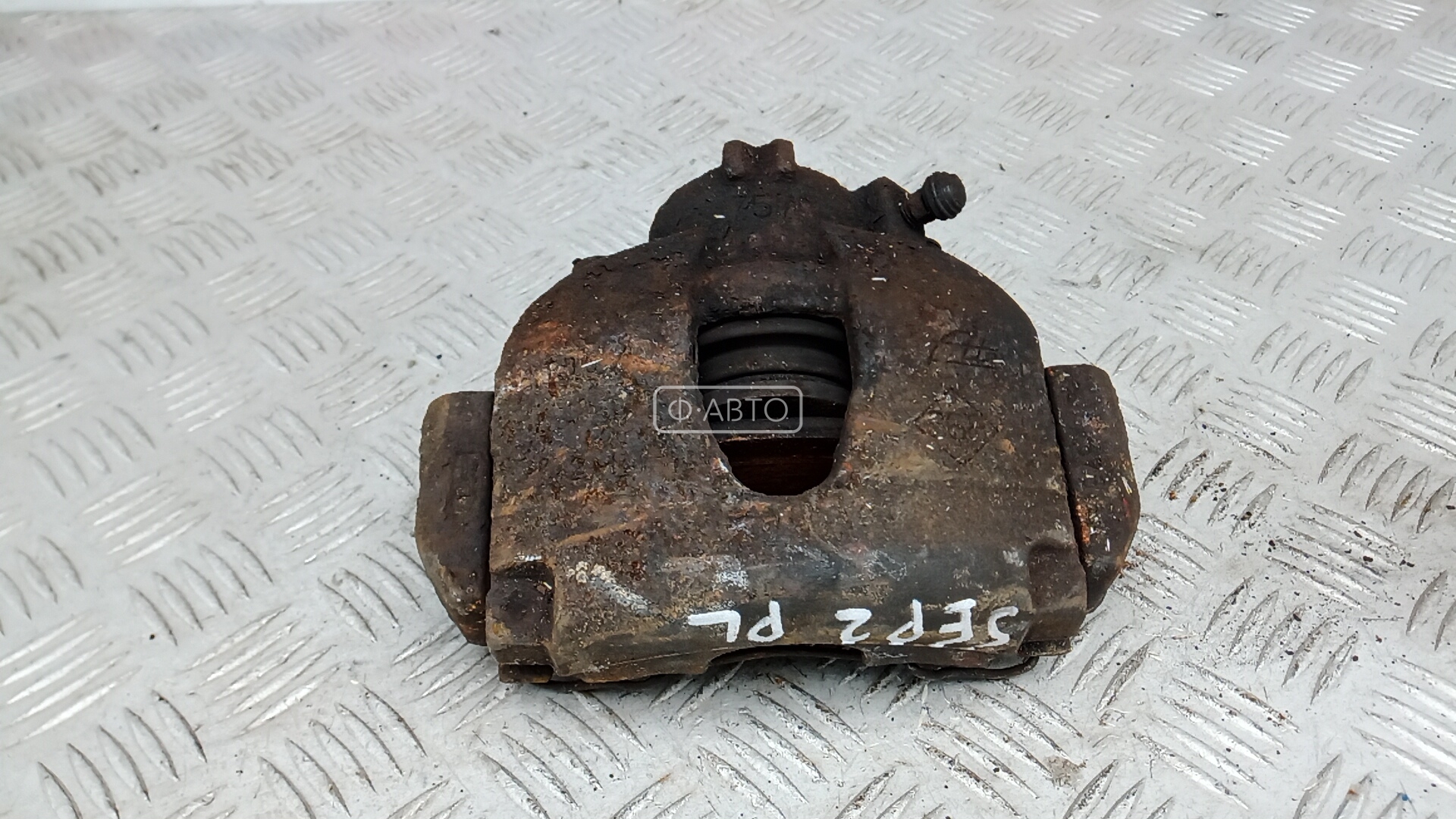 Суппорт тормозной передний левый