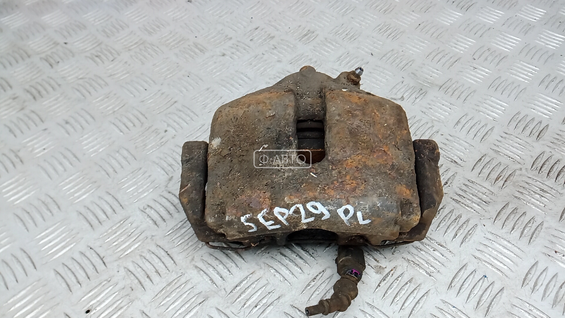 Суппорт тормозной передний левый