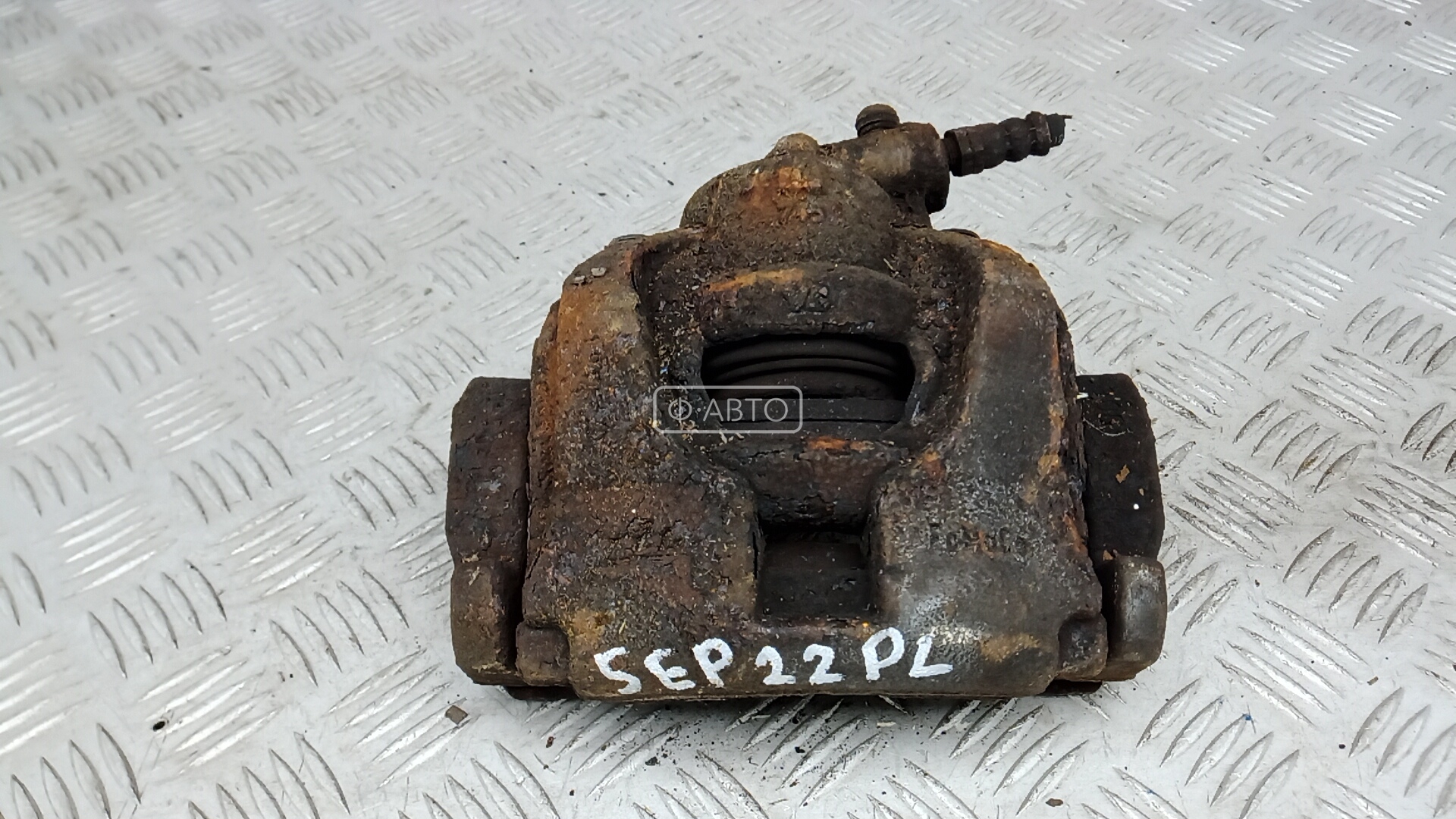 Суппорт тормозной передний левый