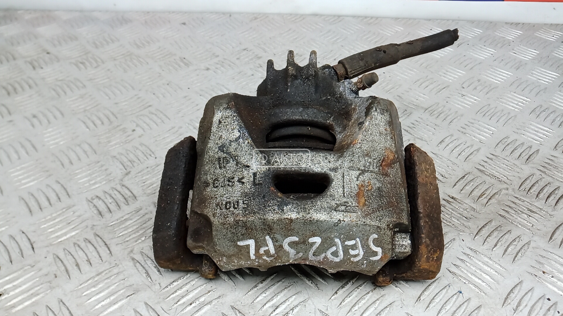 Суппорт тормозной передний левый