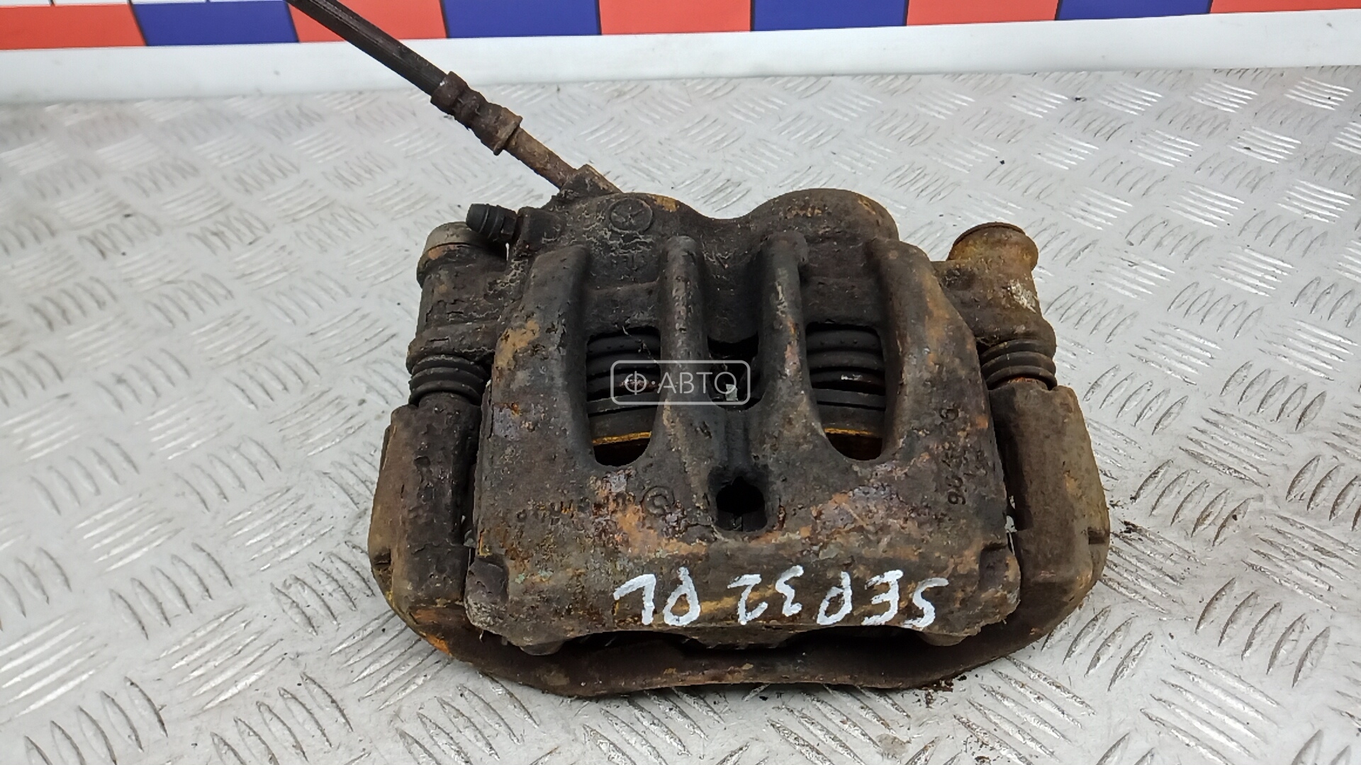 Суппорт тормозной передний левый