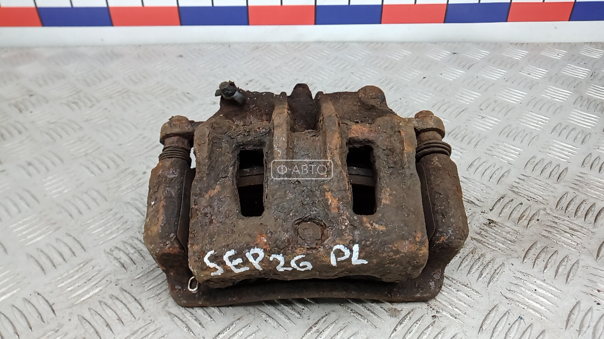 Суппорт тормозной передний левый